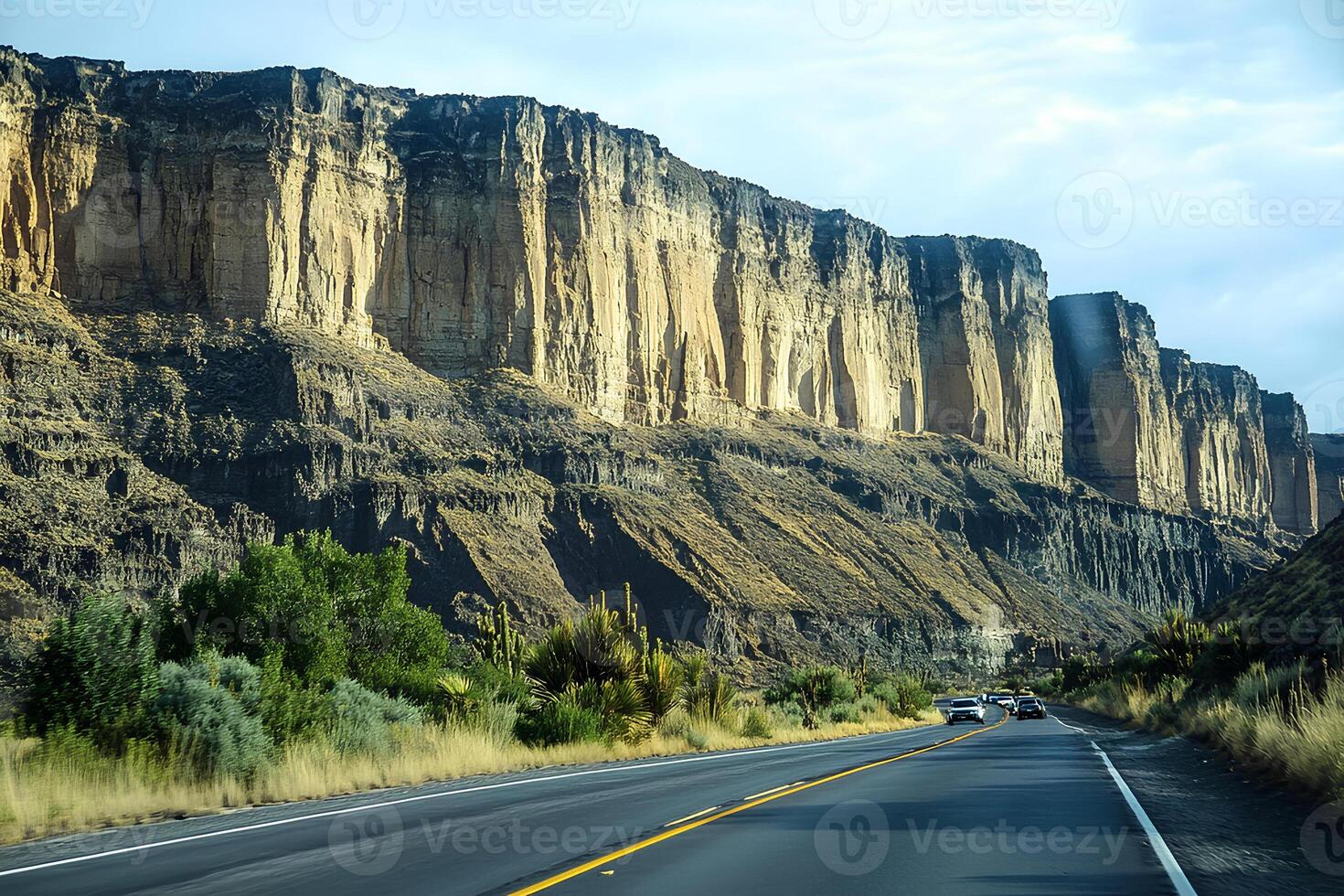 A beautiful highway winding through the stunning landscape of Capitol Reef National Park, showcasing red rock formations and desert terrain photo