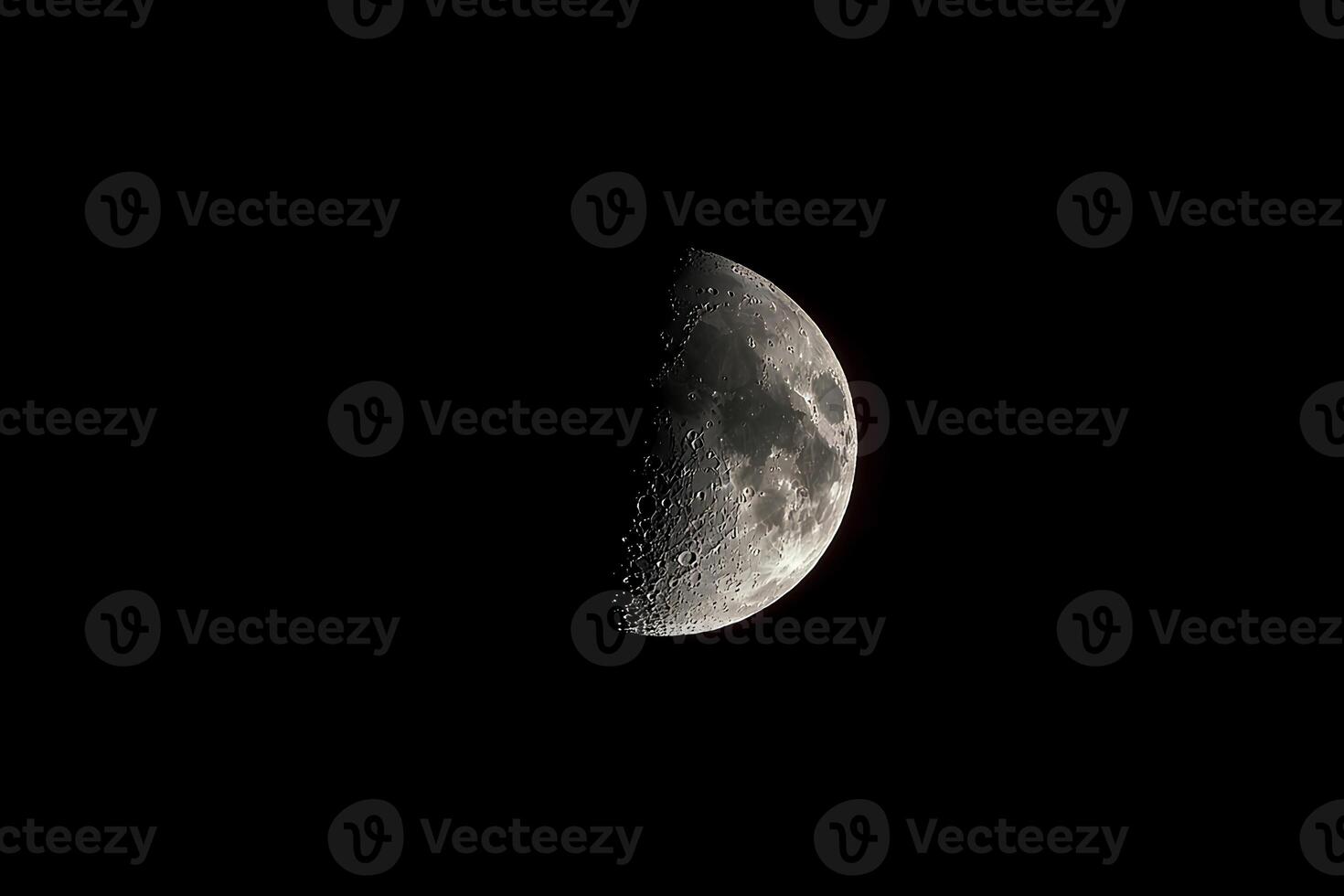 A close-up view of the moon's surface, revealing intricate details of craters and lunar texture, illuminated by the night sky photo