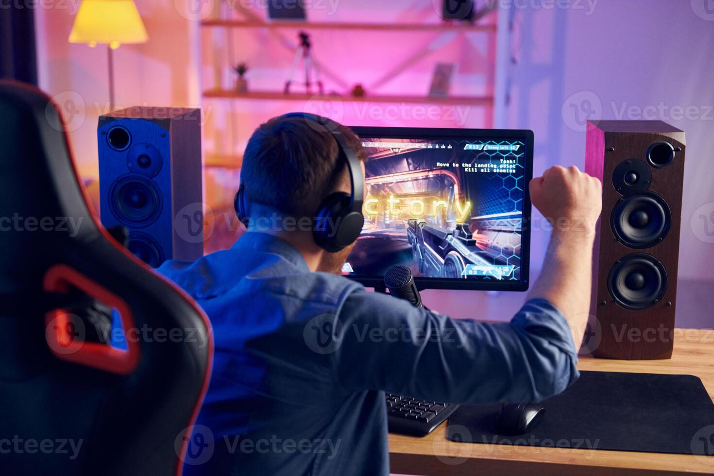 A man playing games on a computer photo