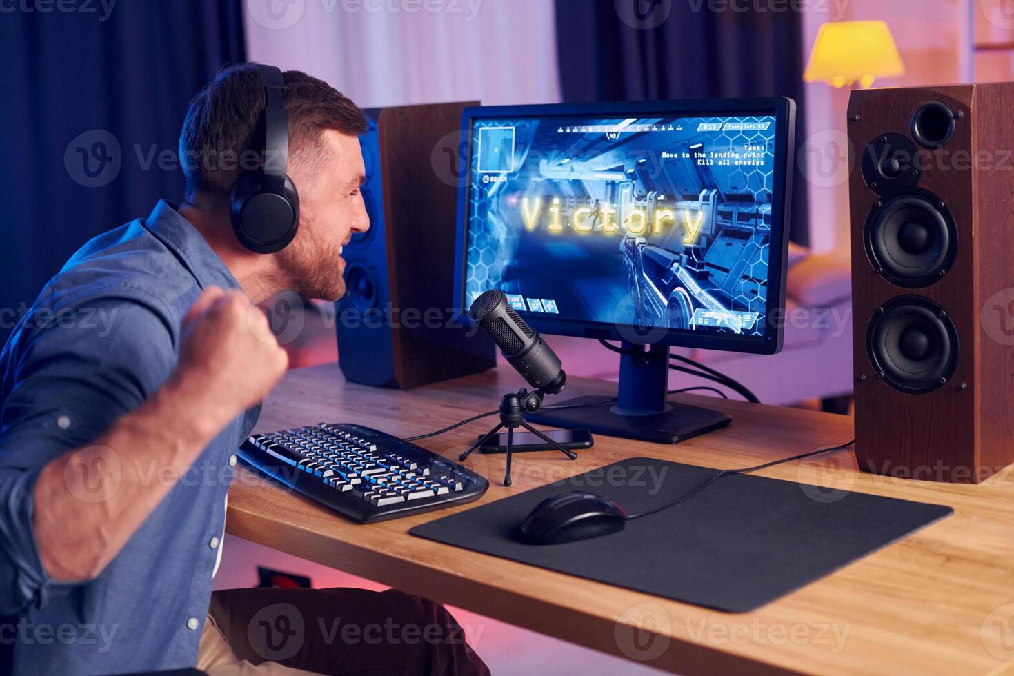 A man is playing games on a computer photo