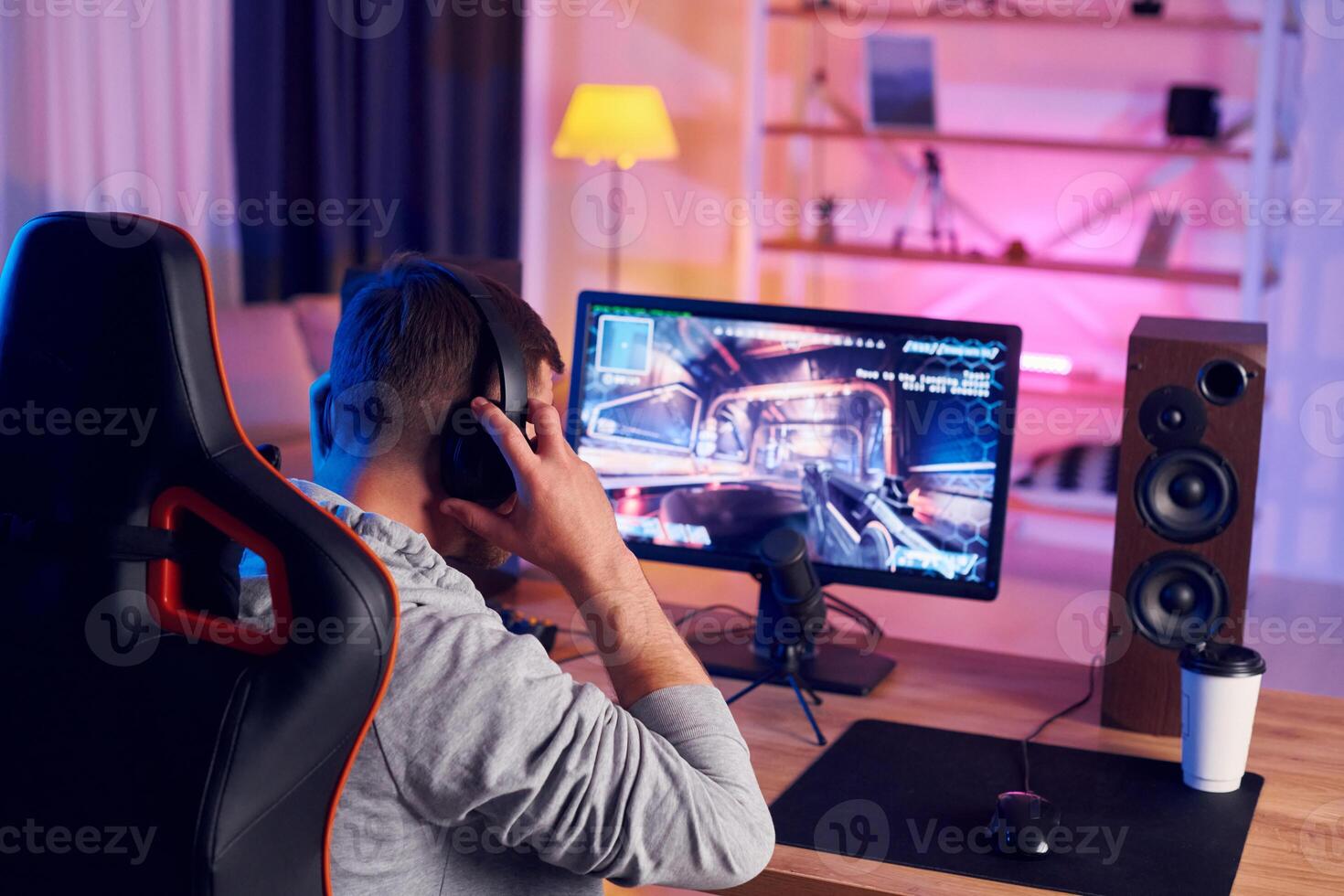 A man is playing games on a computer photo