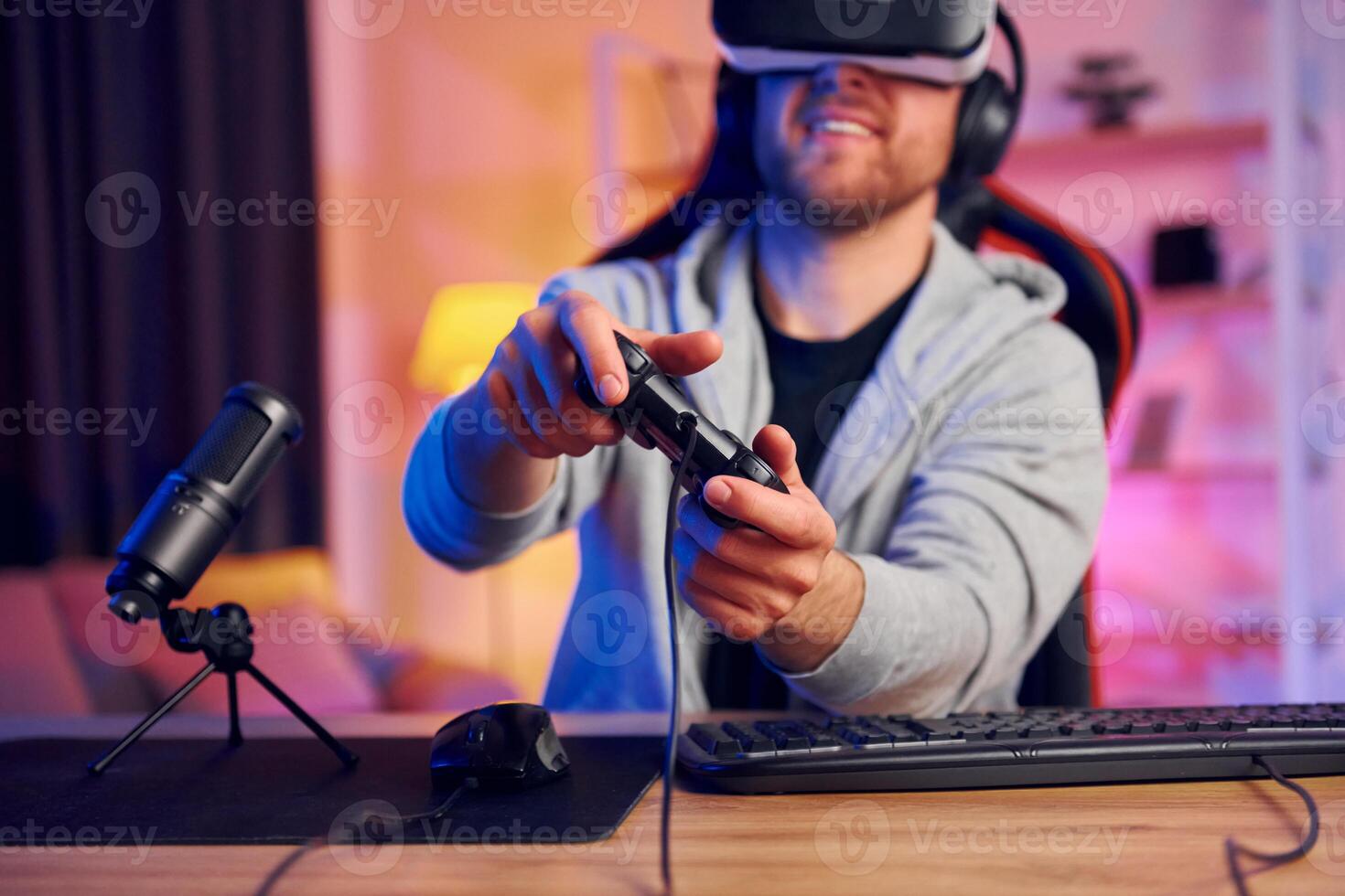 A man wearing a virtual reality headset playing games photo