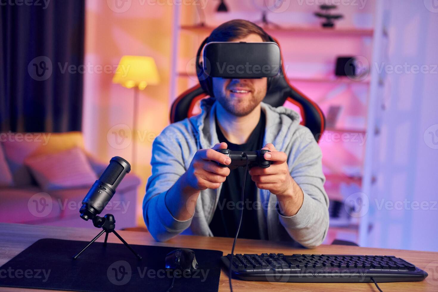 A man wearing a vr headset playing games photo