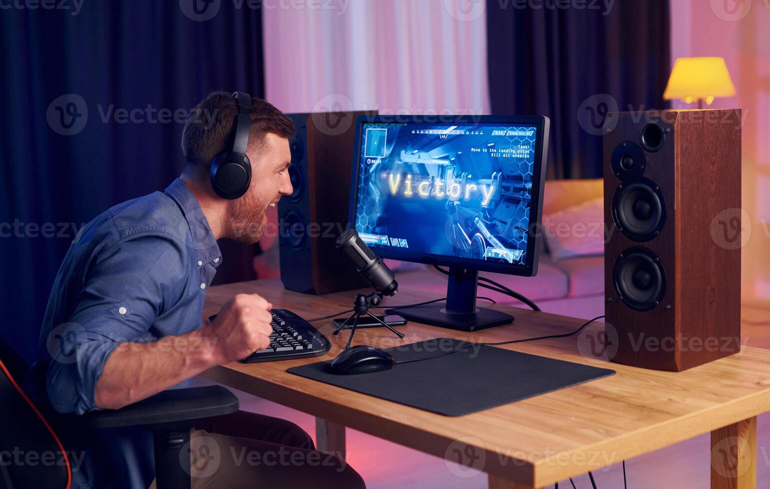 A man is playing games on a computer photo