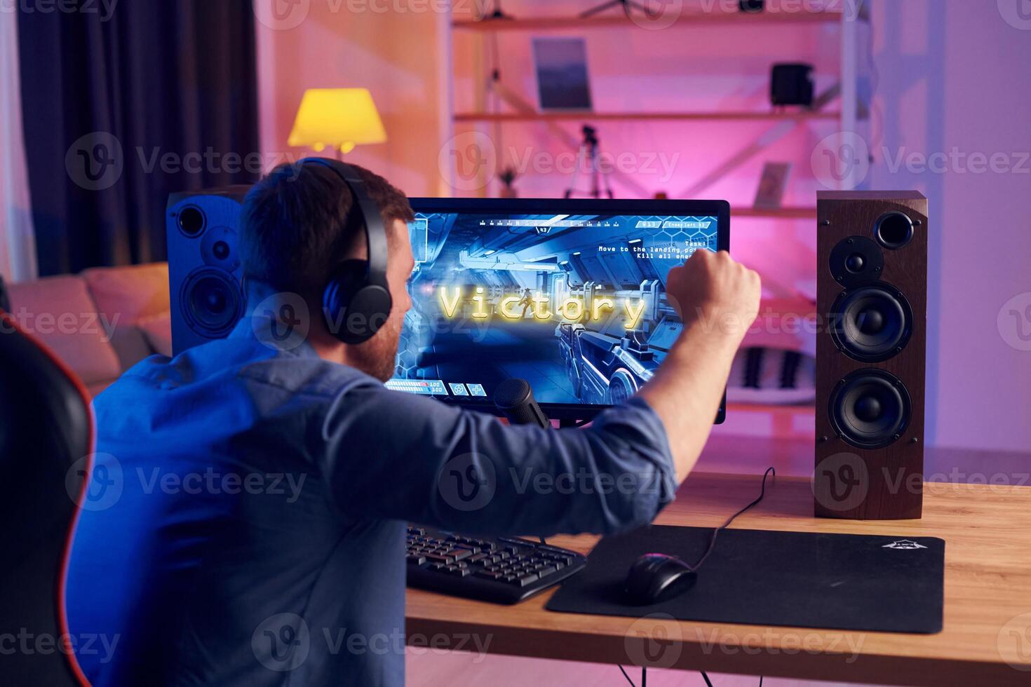 A man playing games on a computer photo