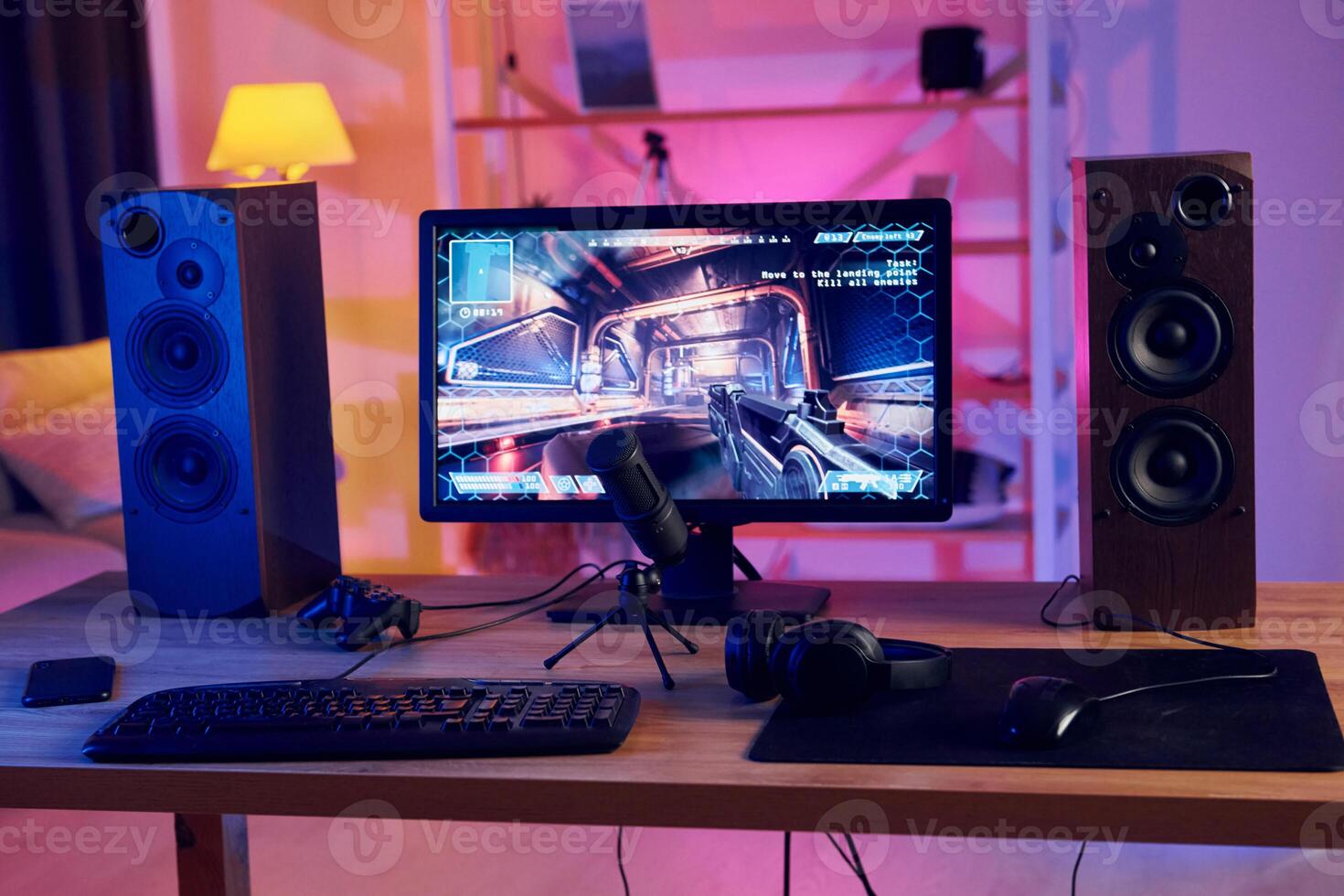A computer monitor, keyboard and mouse on a desk photo