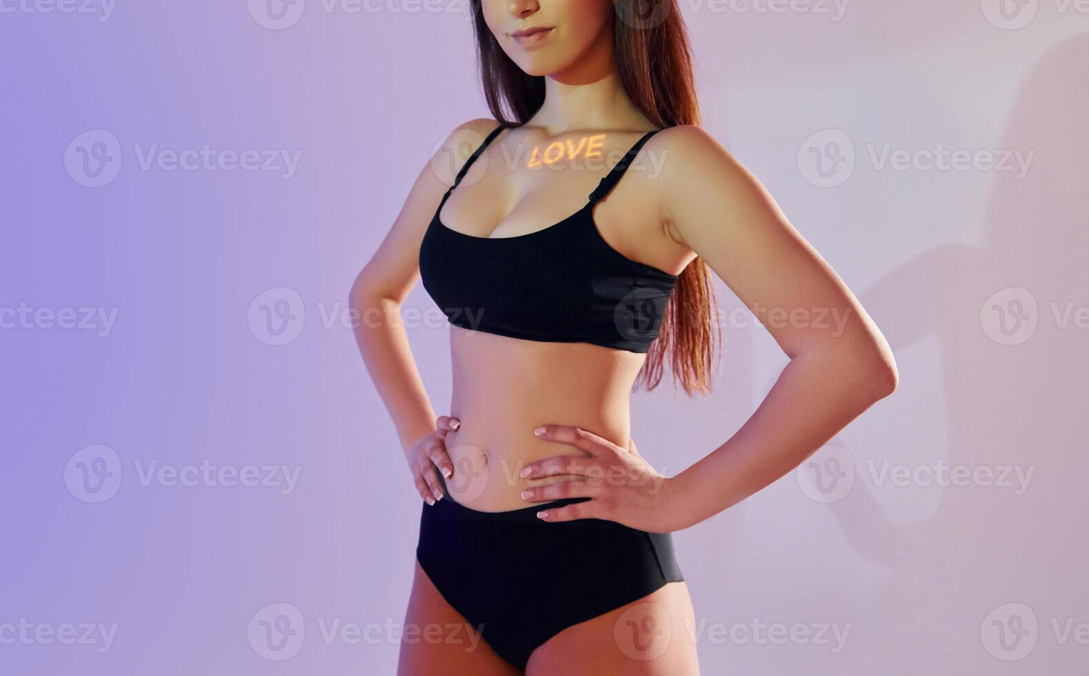 A woman in a black bra top and black underwear photo