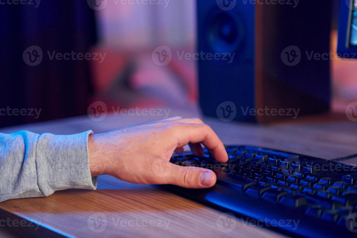 A person is typing on a computer keyboard photo