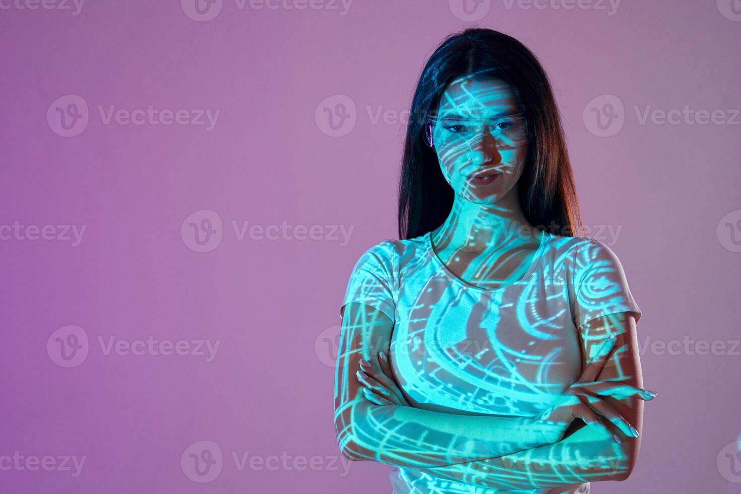 A woman with a glowing face and a blue background photo