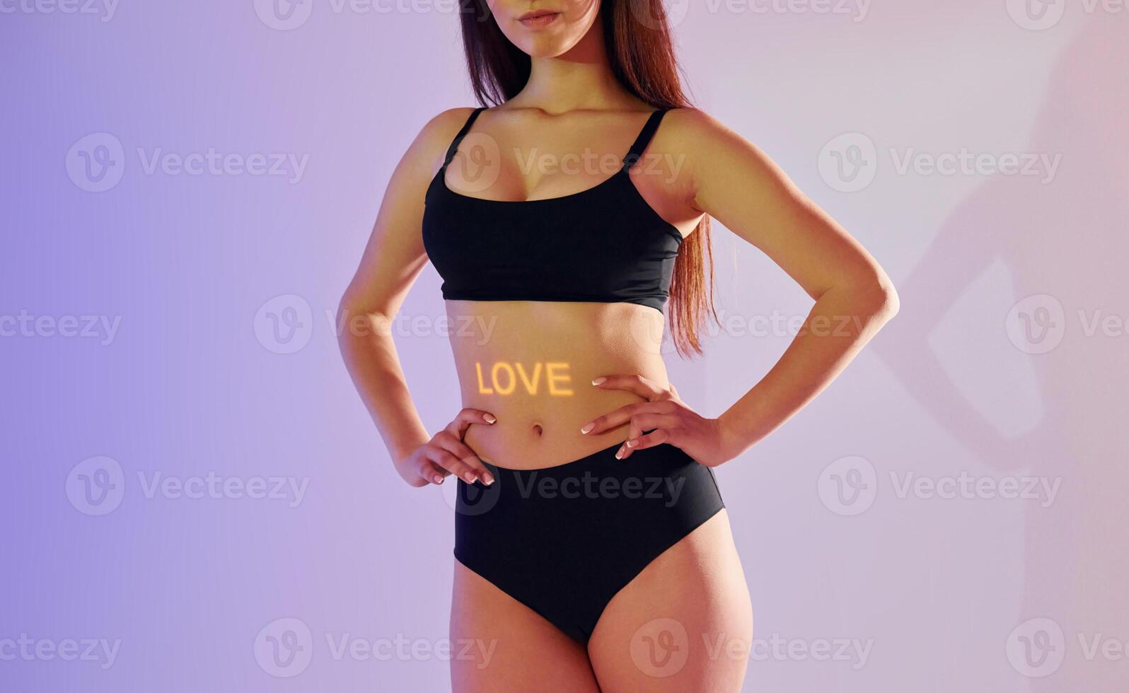 A woman in a black bikini top and underwear photo