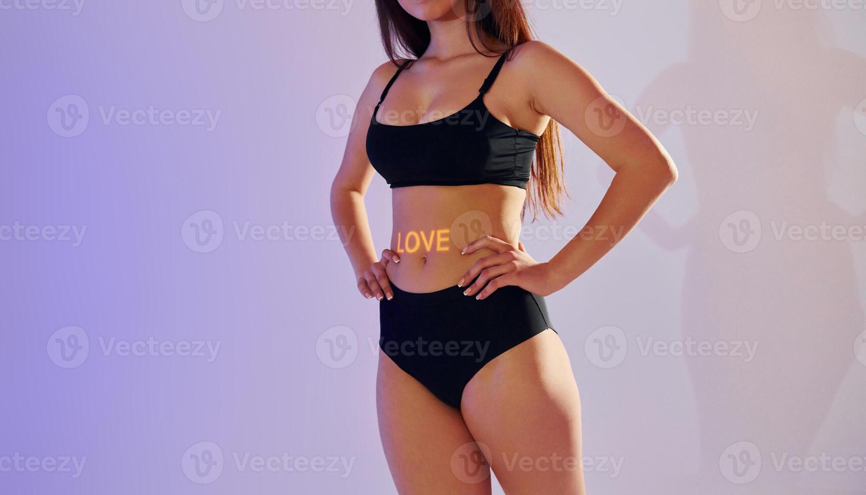 A woman in a black bikini top and black underwear photo