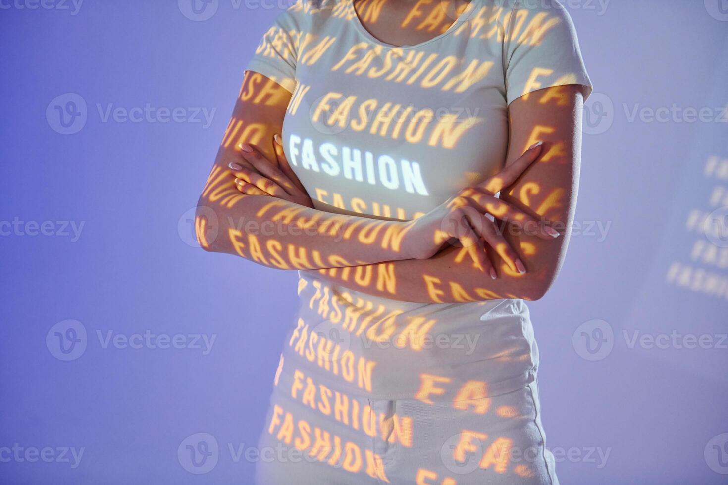 A woman in a white shirt with the words fashion on it photo