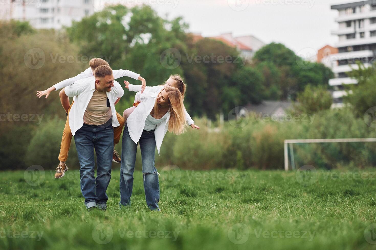 A family is playing in the grass photo