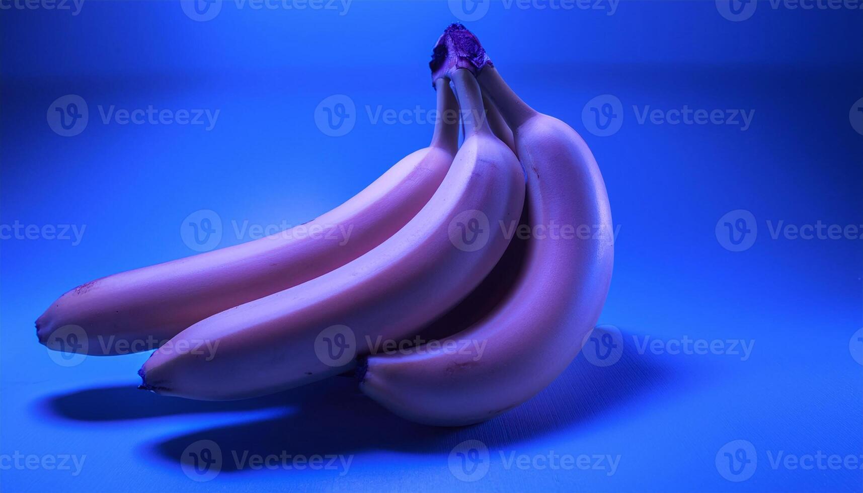 Fresh and Vibrant Bunch of Bananas on Blue photo