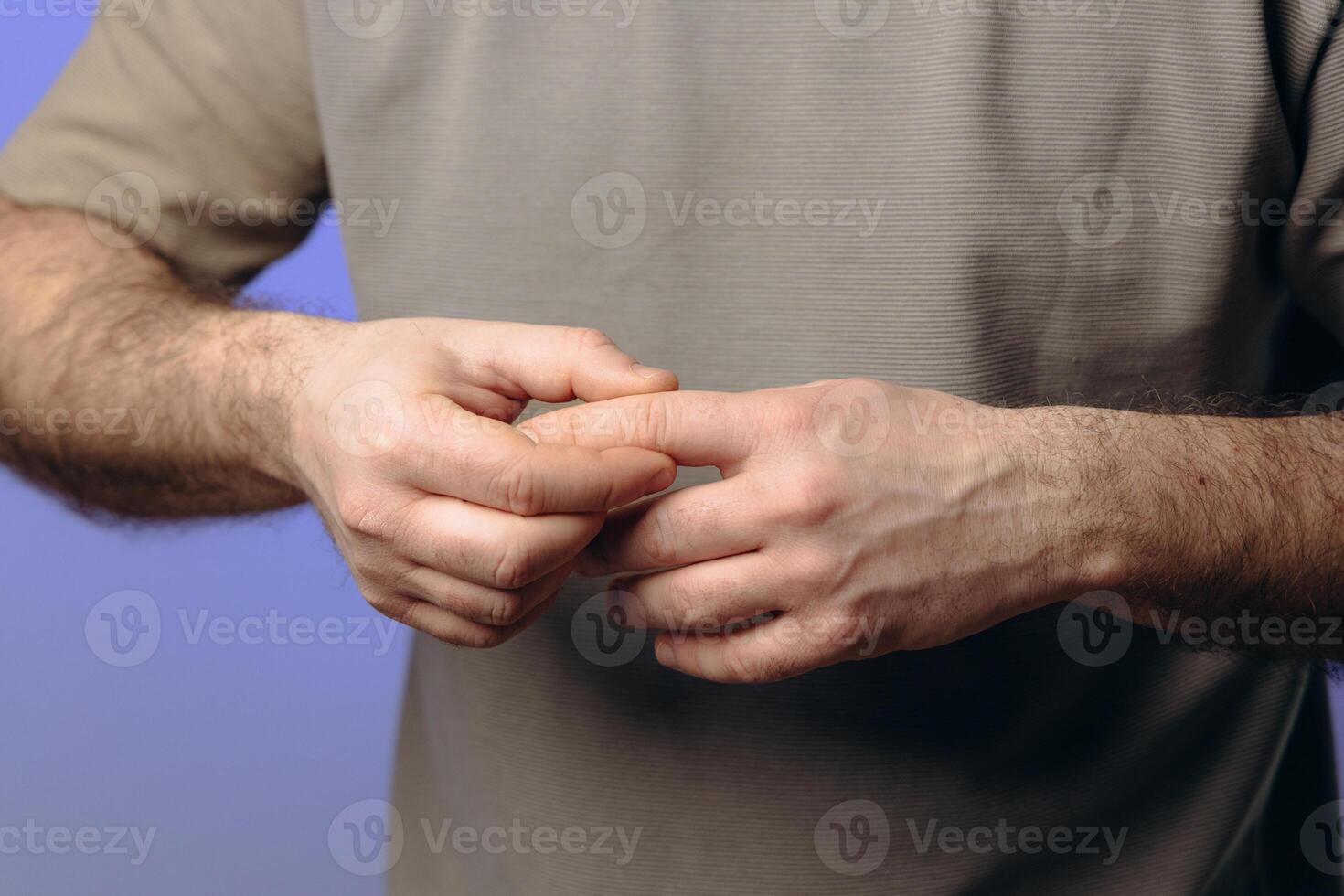 man suffers from chronic arthritis. pain in the joints of the fingers. inflammation of the joints, which can be caused by osteoarthritis wear of cartilage or rheumatoid arthritis. hands close-up photo