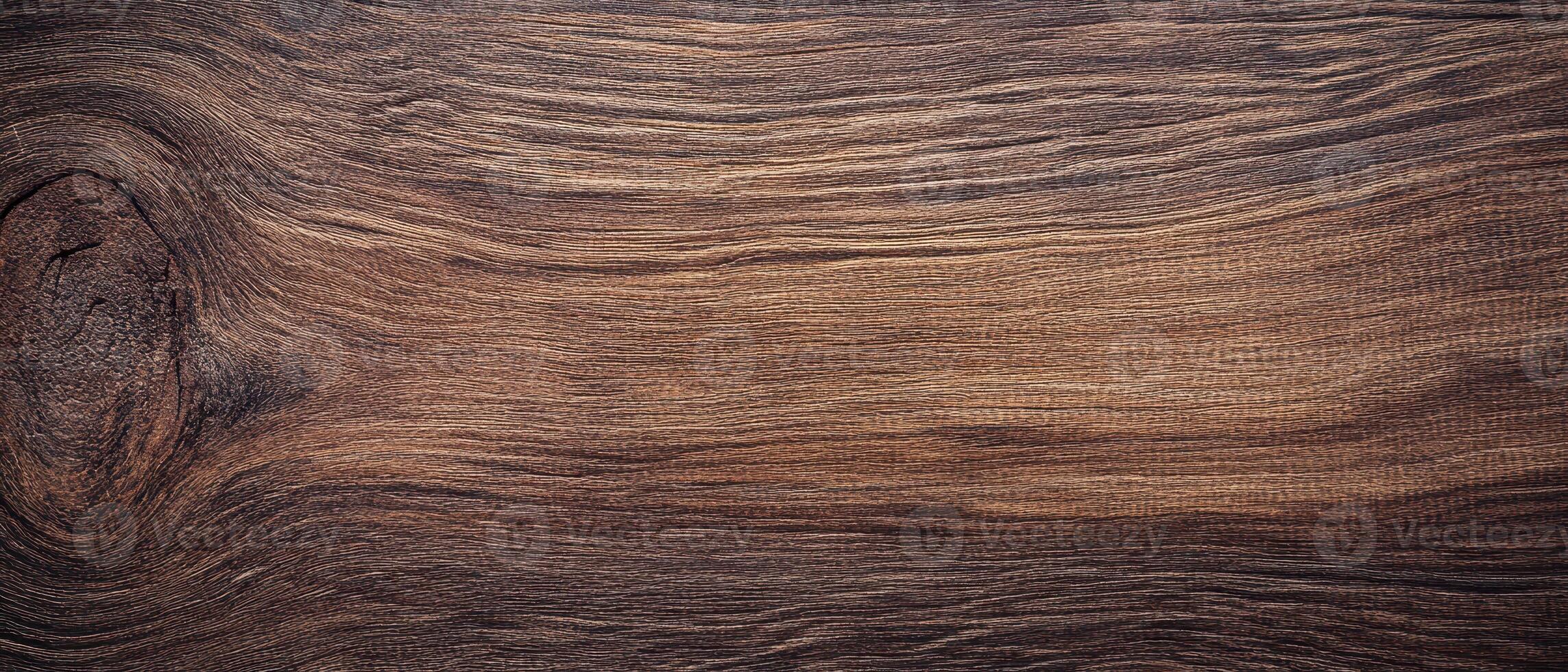 A close up of a wooden surface with a dark stain photo