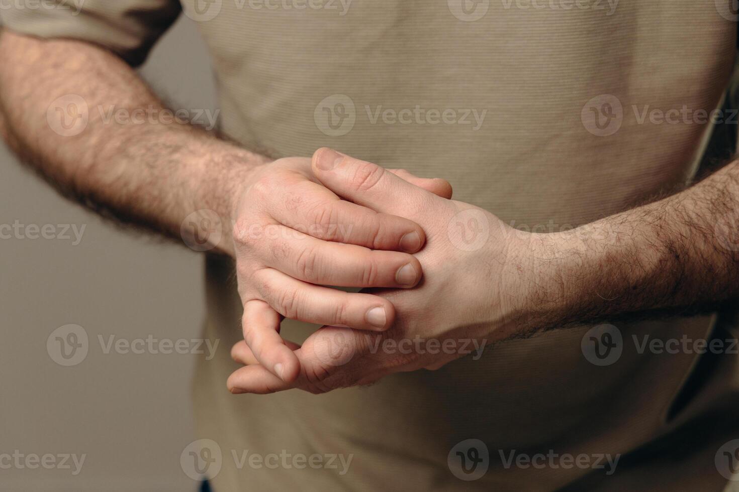 man suffers from chronic arthritis. pain in the joints of the fingers. inflammation of the joints, which can be caused by osteoarthritis wear of cartilage or rheumatoid arthritis. hands close-up photo