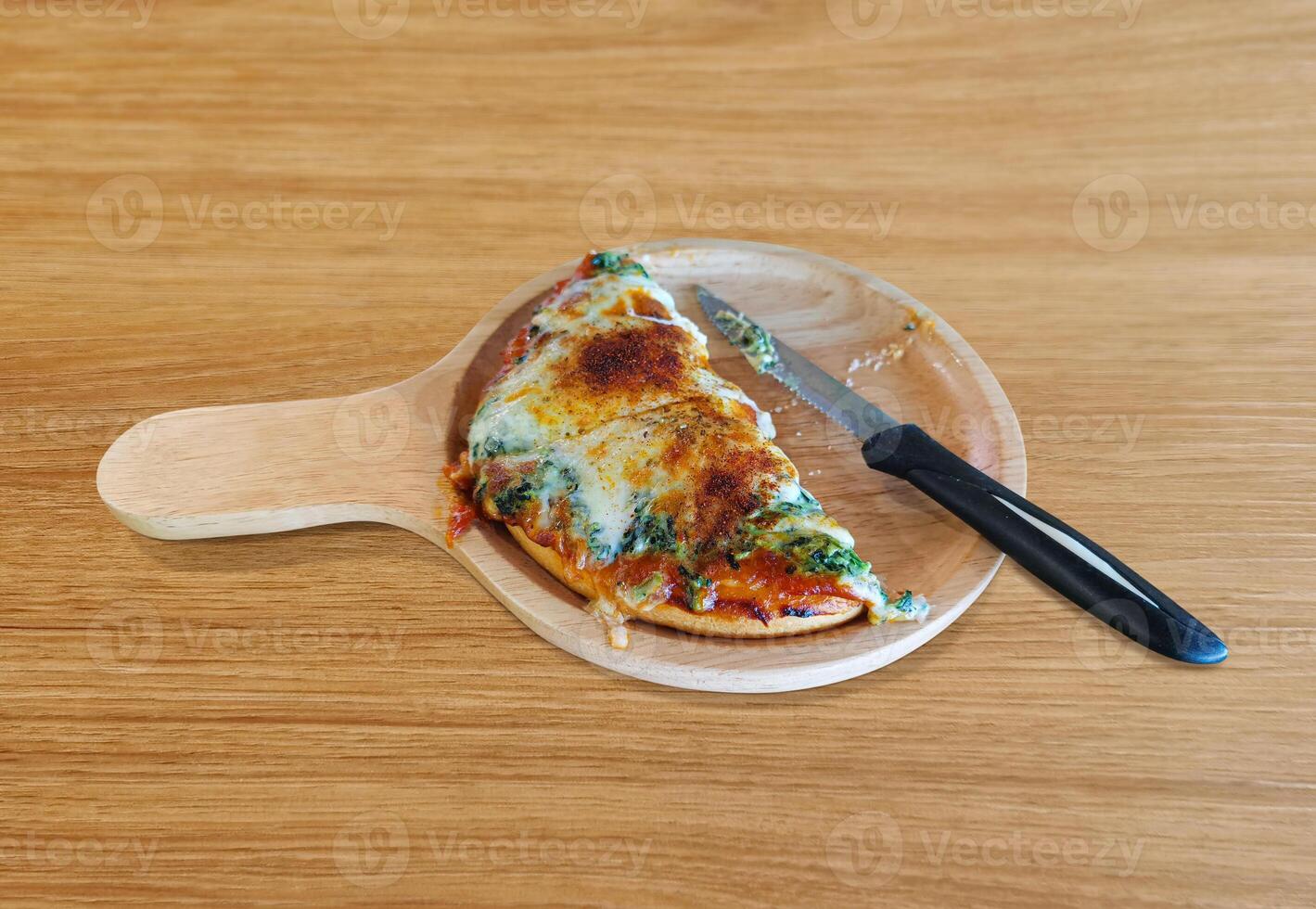 Spinach and Cheese Pizza, Halved, Italian Food, on Wooden Table photo