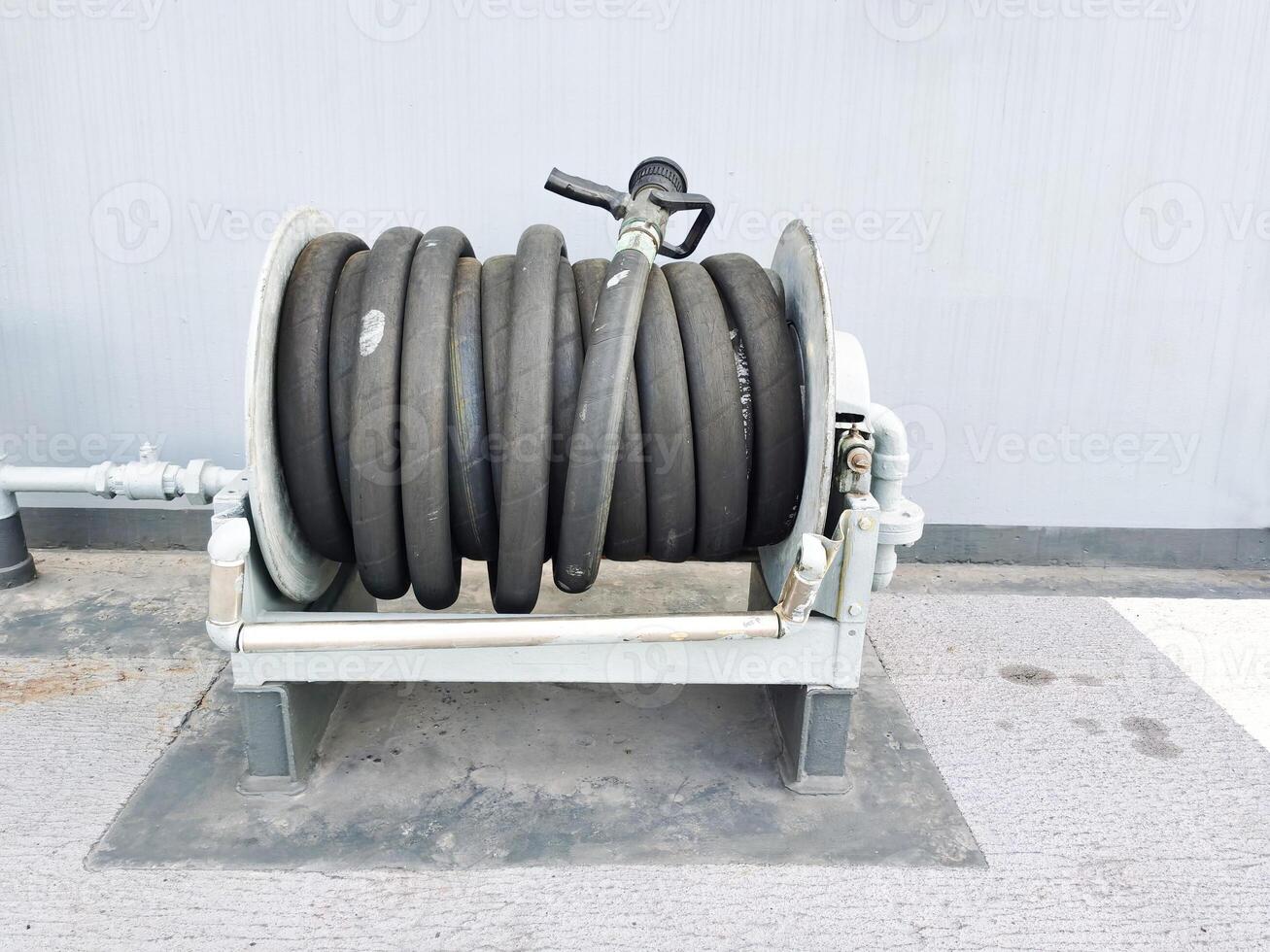 Black fire hose on a ship to prevent fire. photo