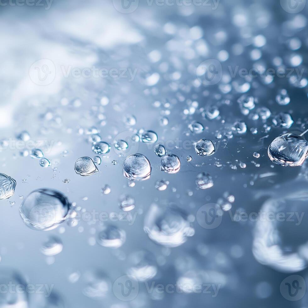 Water droplets on a surface with a blue background photo