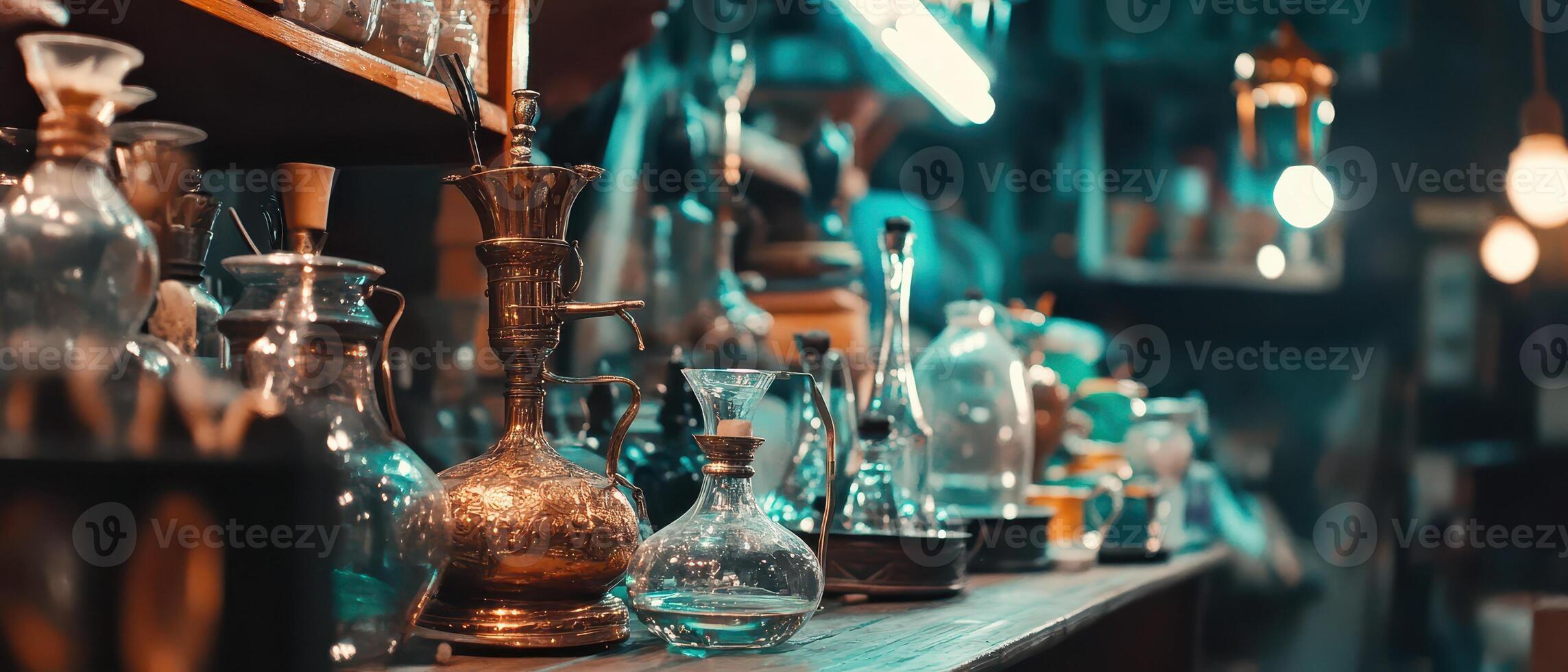 A collection of glass bottles and other items on a shelf photo