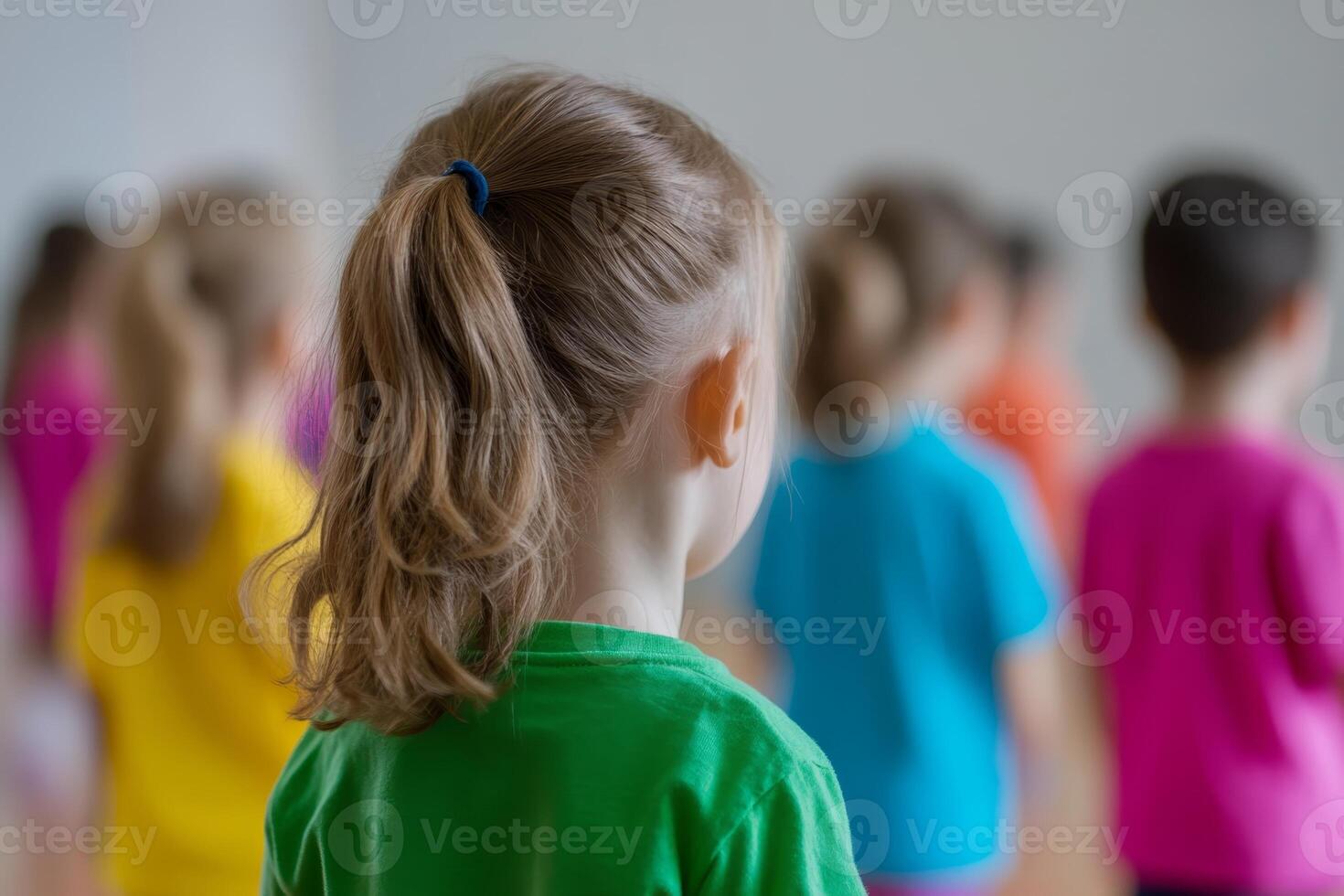 Children participate in a vibrant dance class in a bright studio setting during afternoon hours photo