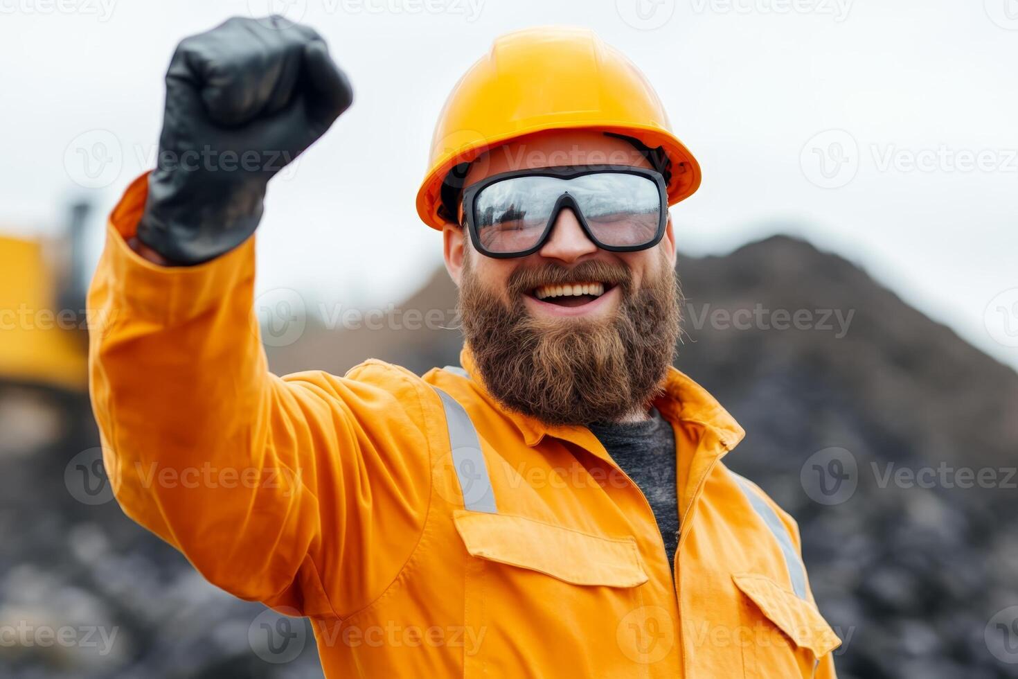 Construction worker celebrates achievement with a joyful gesture at the site photo