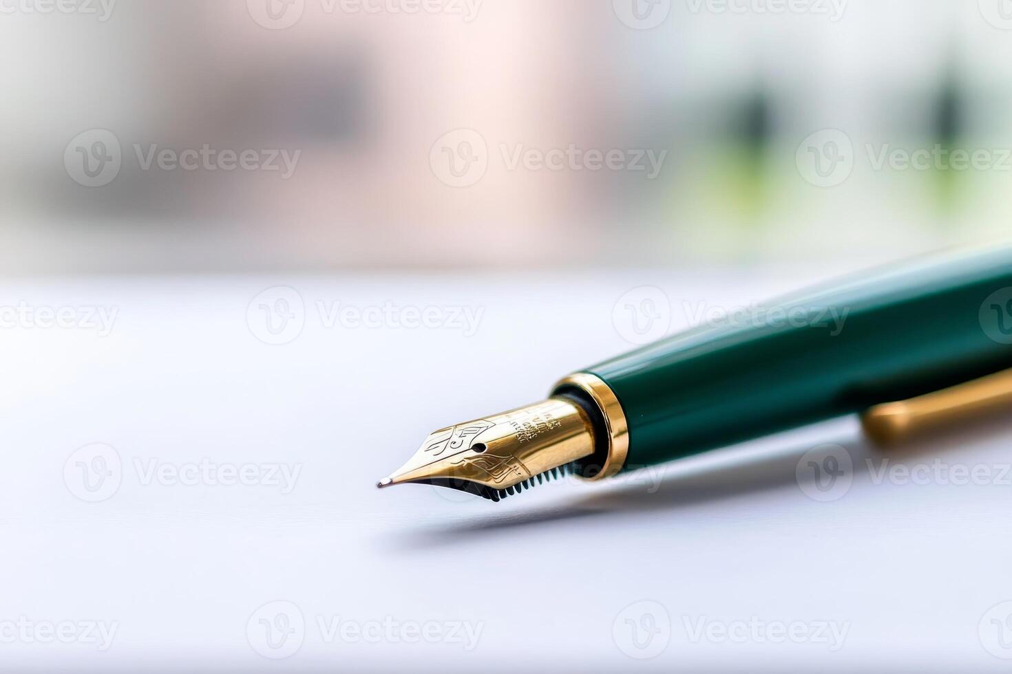 Fine fountain pen rests on a crisp white surface in a bright workspace illuminated by natural light photo