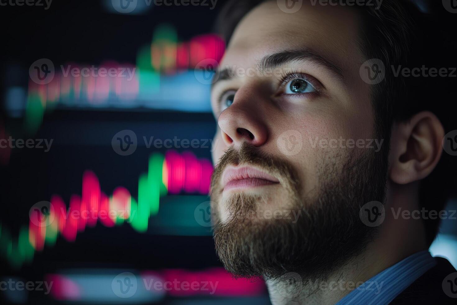 Professional man analyzing stock market trends with digital graphics displayed behind him in a modern office environment photo