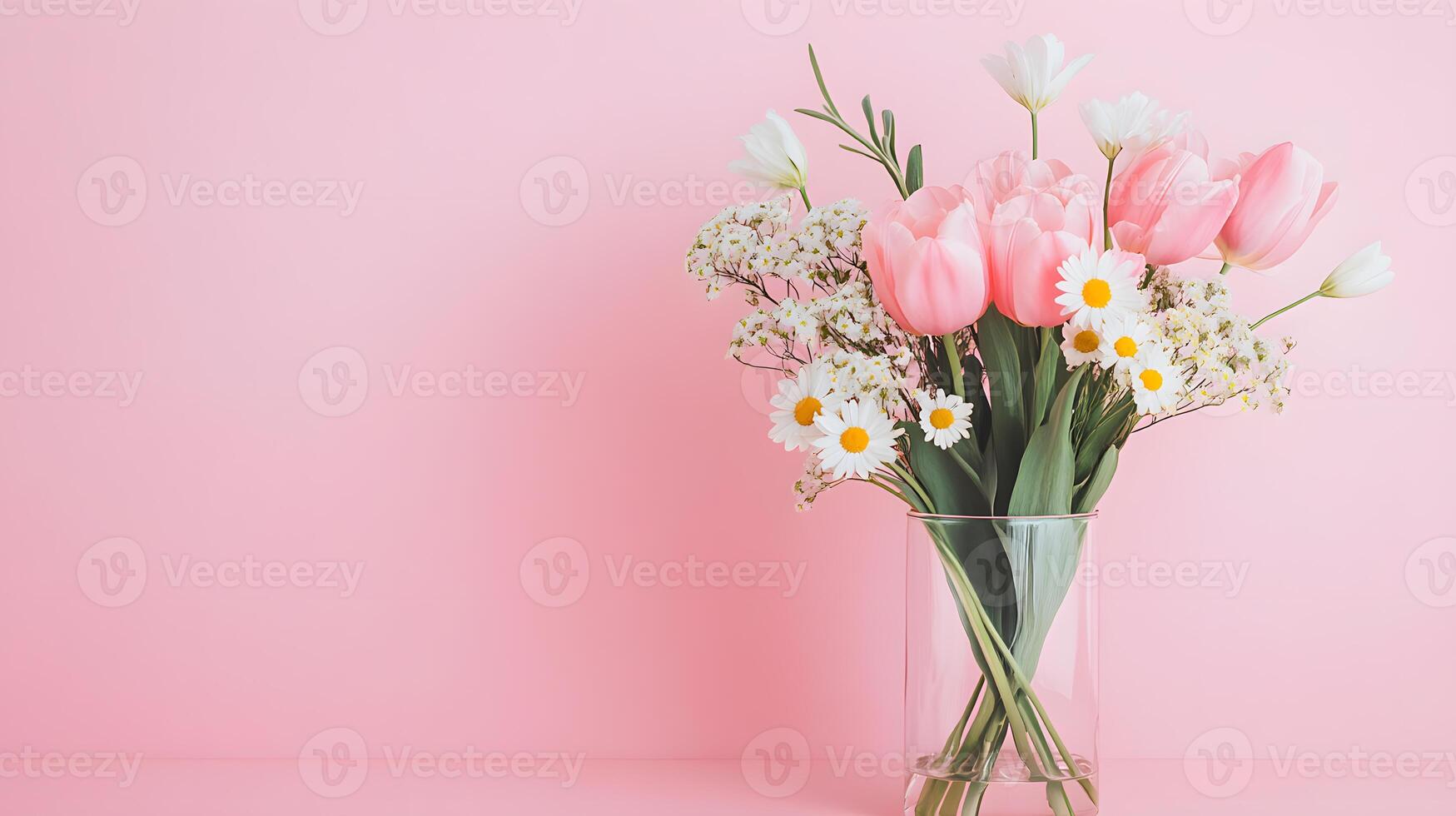 Bouquet of pastel tulips and daisies nestled in a transparent glass vase on a soft background photo