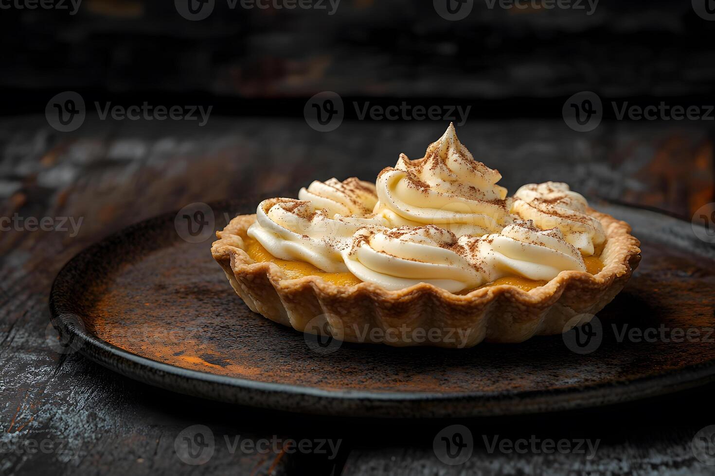 Spiced pumpkin tart with a buttery golden crust and smooth, creamy custard filling. photo
