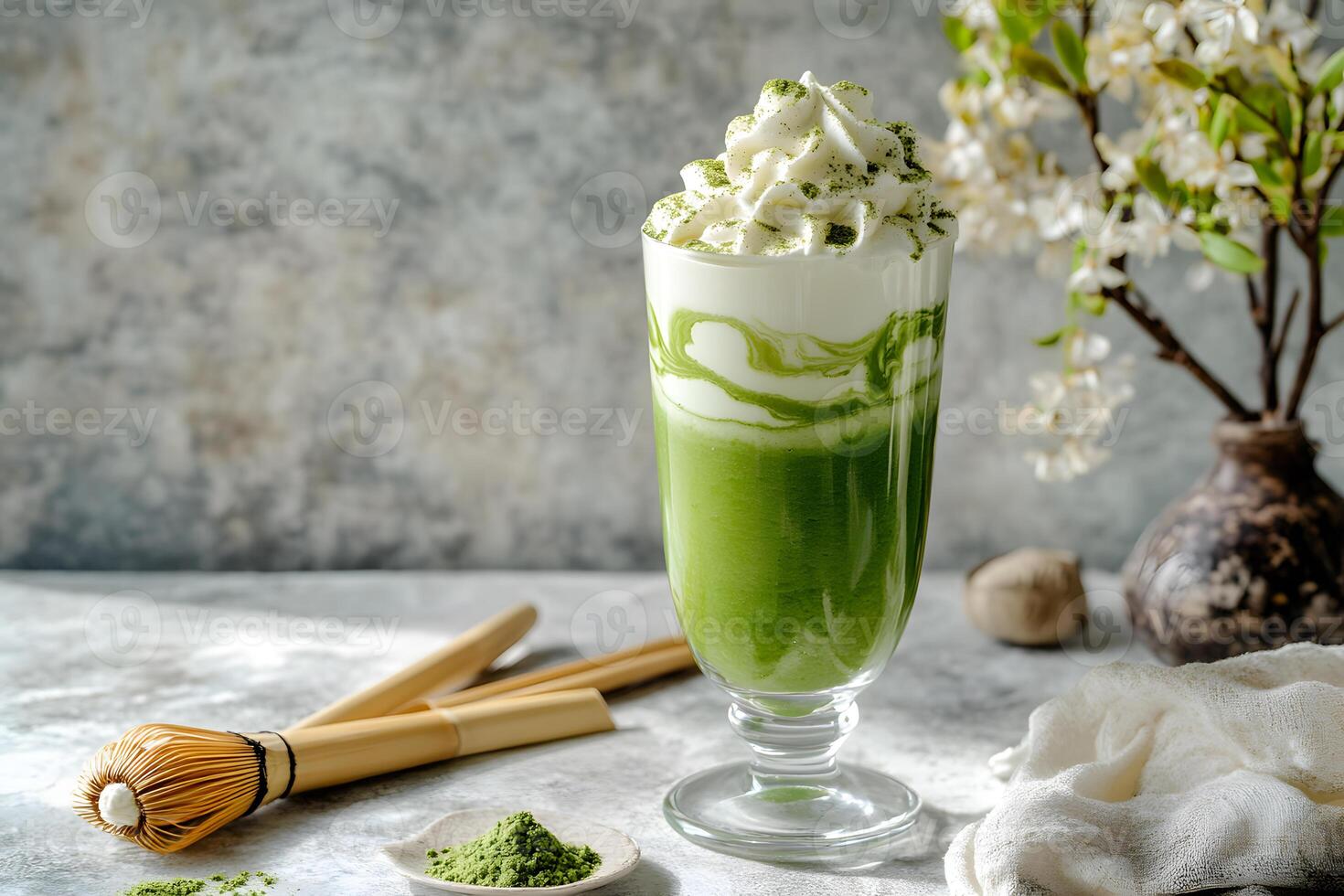 Layered matcha green tea smoothie with swirl effect in a tall glass for a visually striking and refreshing drink photo