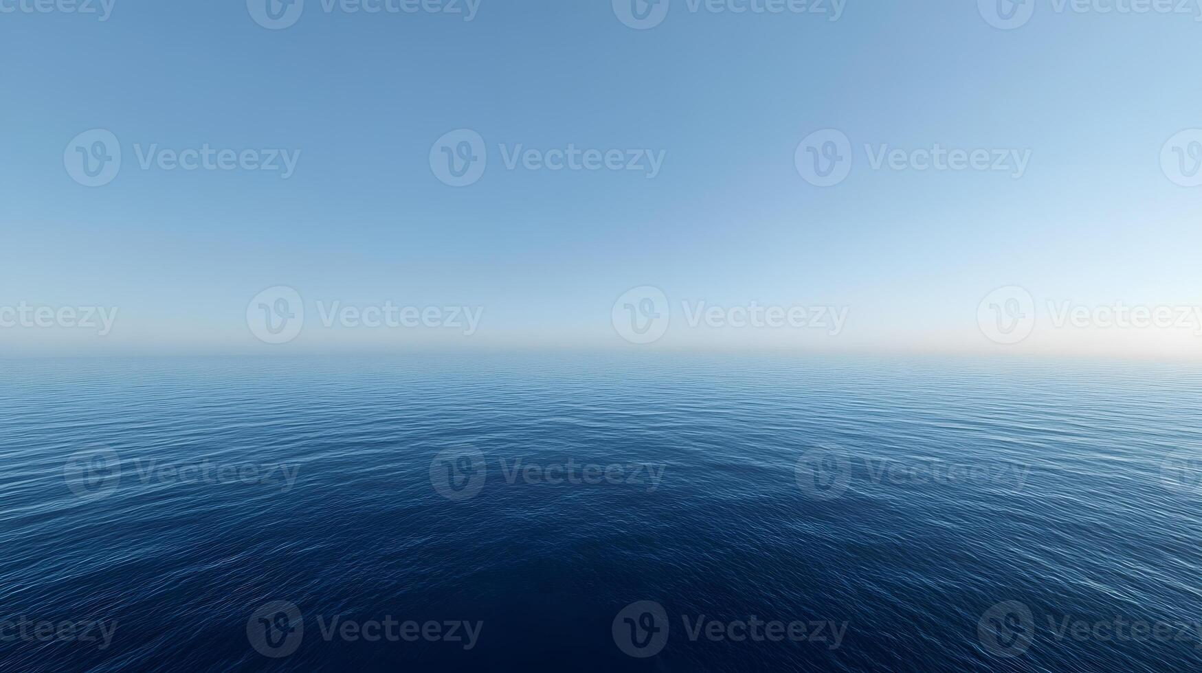 Gentle ripples on a smooth blue ocean beneath a clear, cloudless sky photo