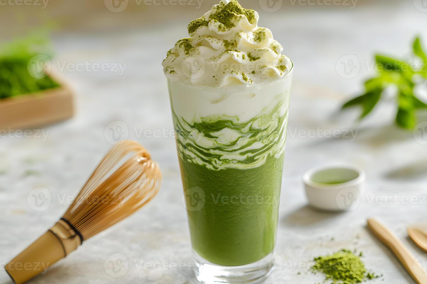 Layered matcha green tea smoothie in a tall glass with a beautiful swirl effect for a refreshing drink photo