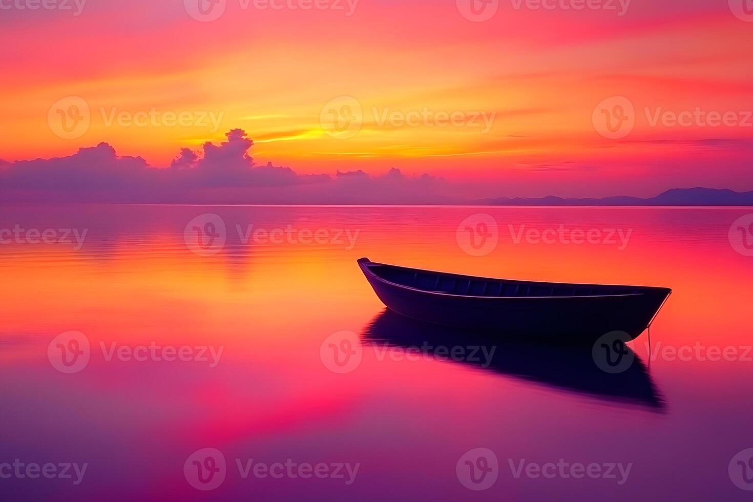 Silhouette of a boat on the horizon against a sky with warm orange and pink hues during sunset photo