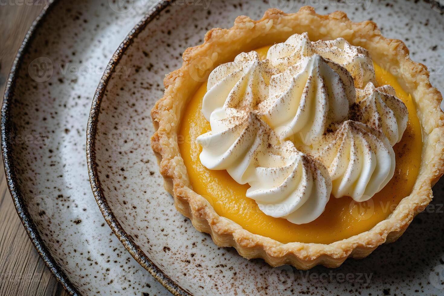 Flaky pumpkin tart with spiced custard filling and a golden, buttery crust. photo