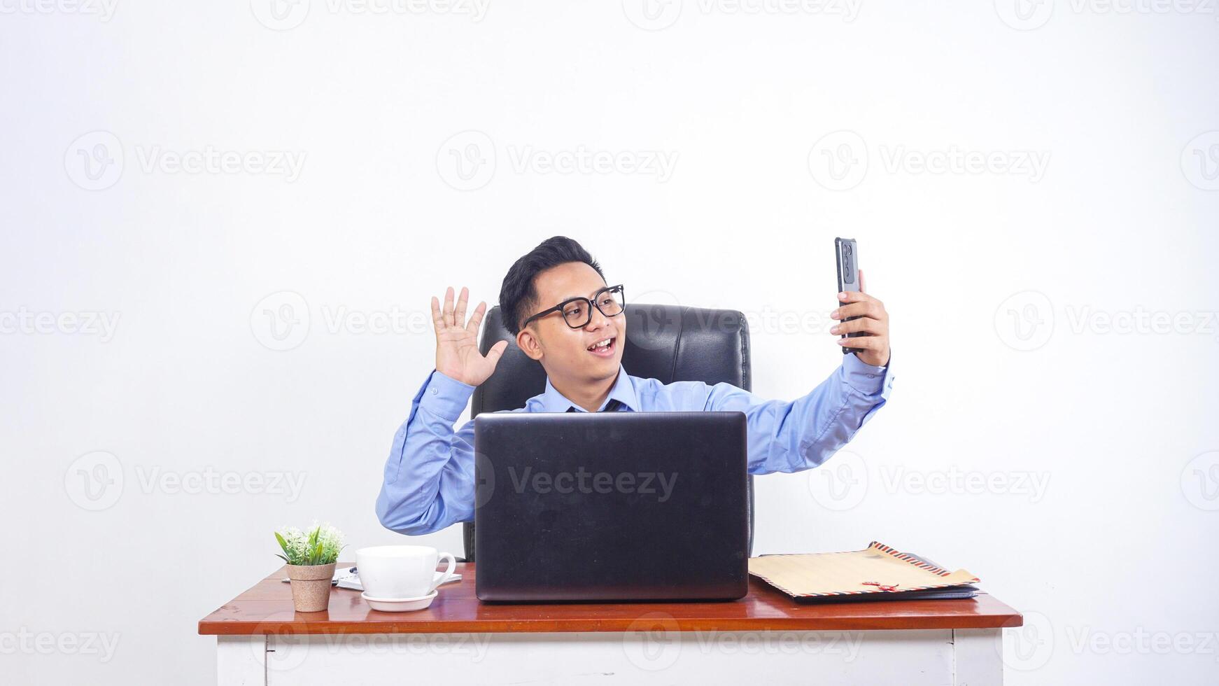 Asian Businessman Employee Talking on The Call with Phone on White Background photo