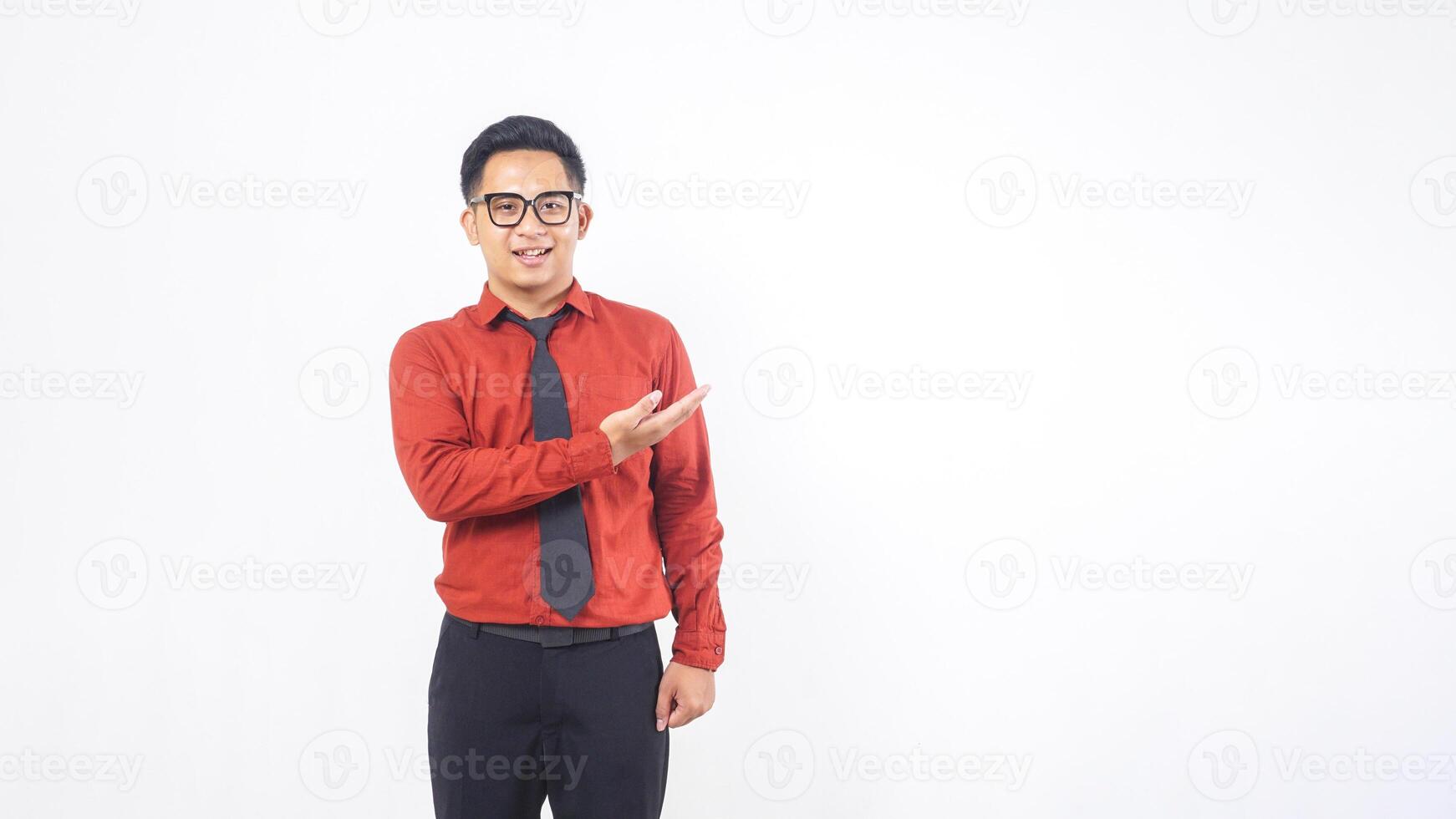 Portrait of Handsome Young Adult Asian Man Presenting Something with Copy Space on White Background photo