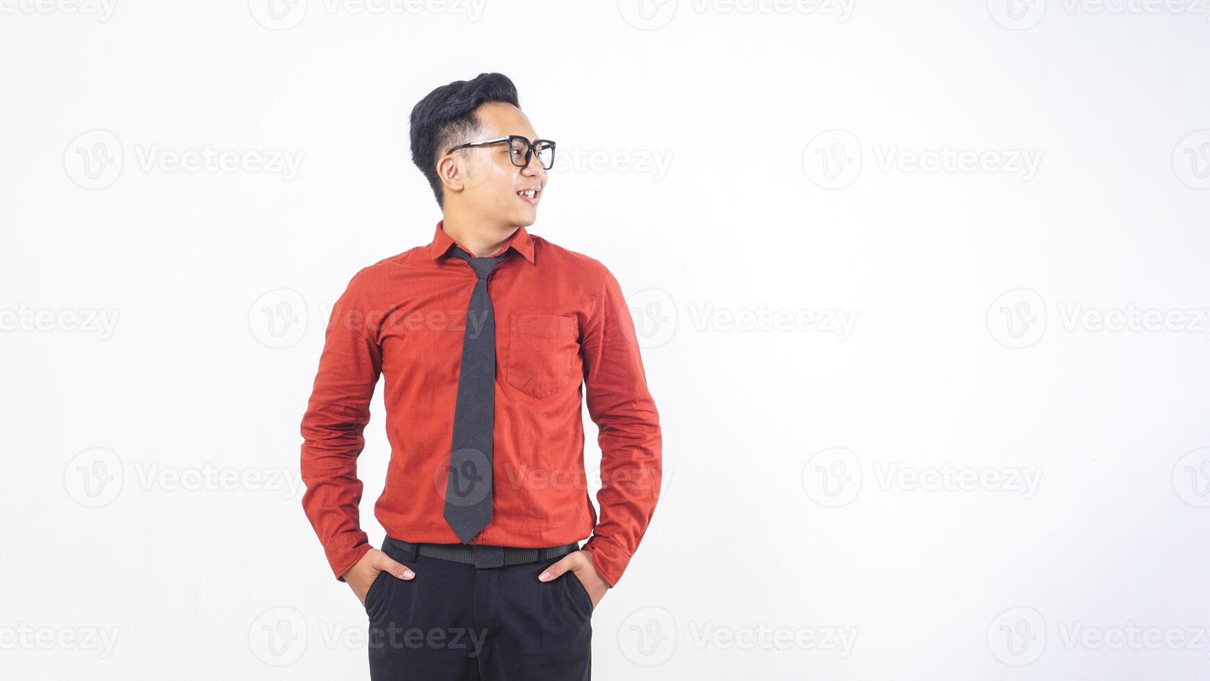 Portrait of Smiling Young Adult Asian Man with Glasses Standing on White Background photo