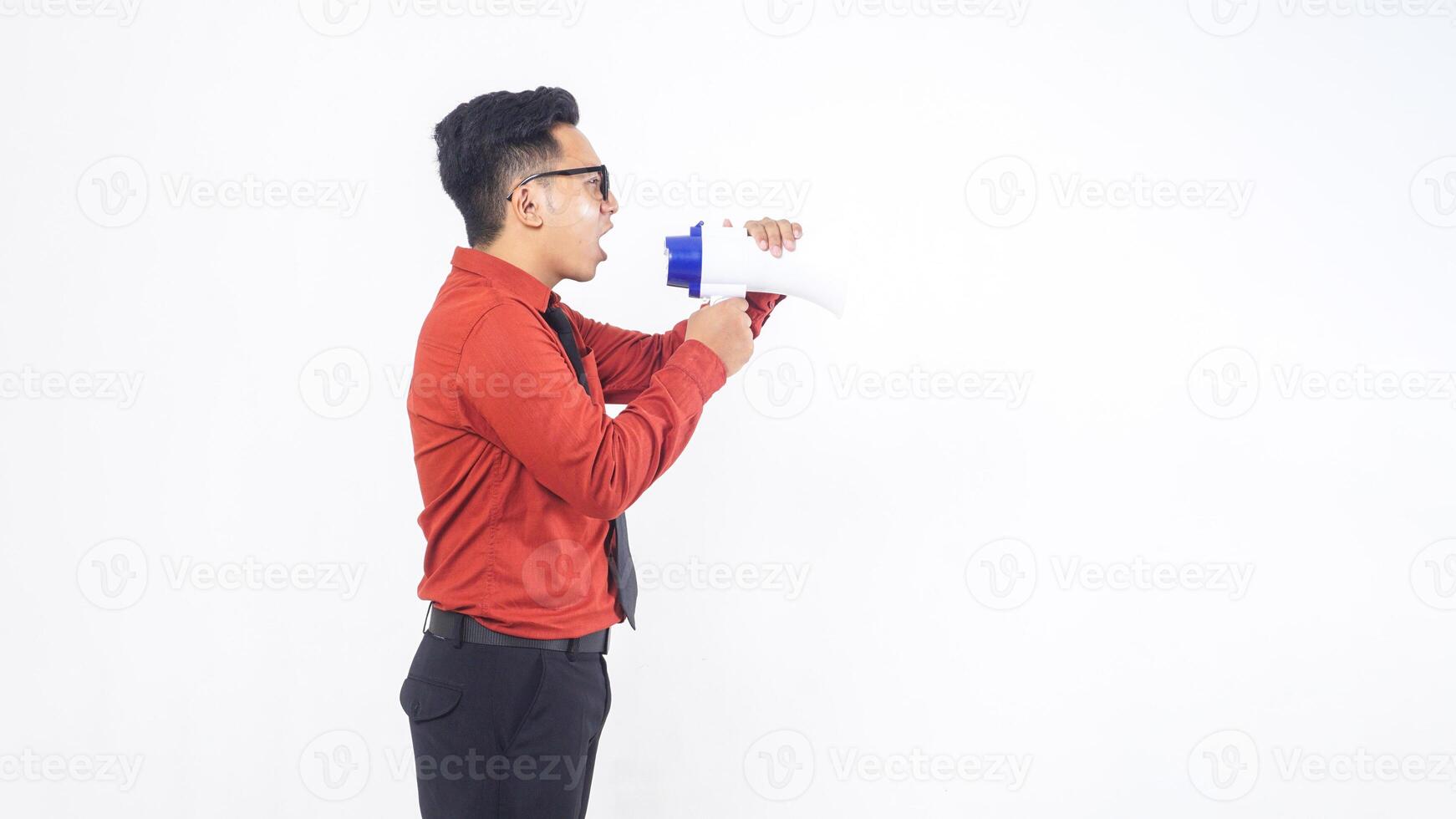 Side View of Asian Male Office Worker Business Man Wearing Formal Outfit Shouting on Megaphone on White Background photo