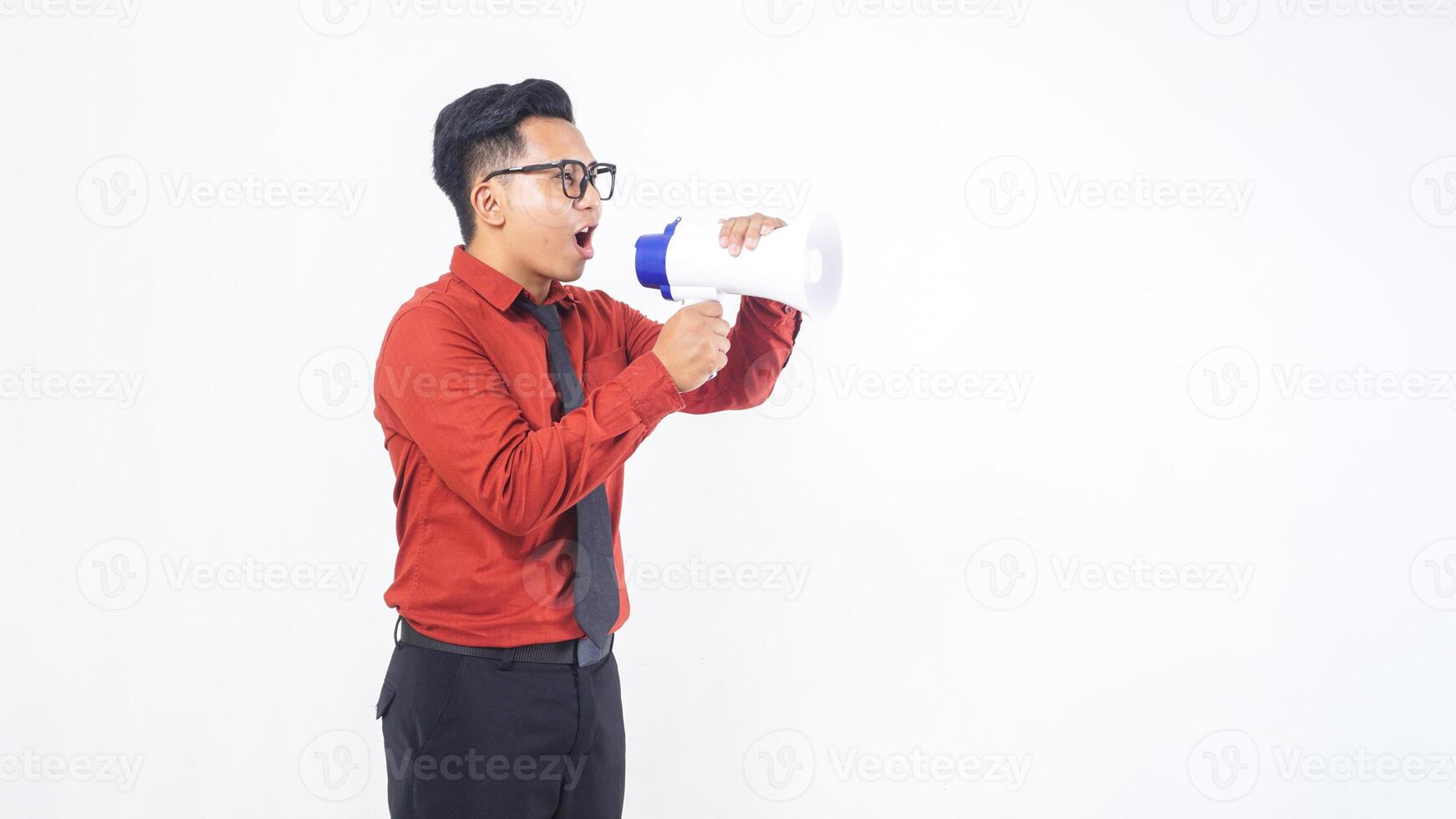 Side View Portrait of Asian Male Office Worker Business Man in Formal Outfit Shouting on Megaphone on White Background photo