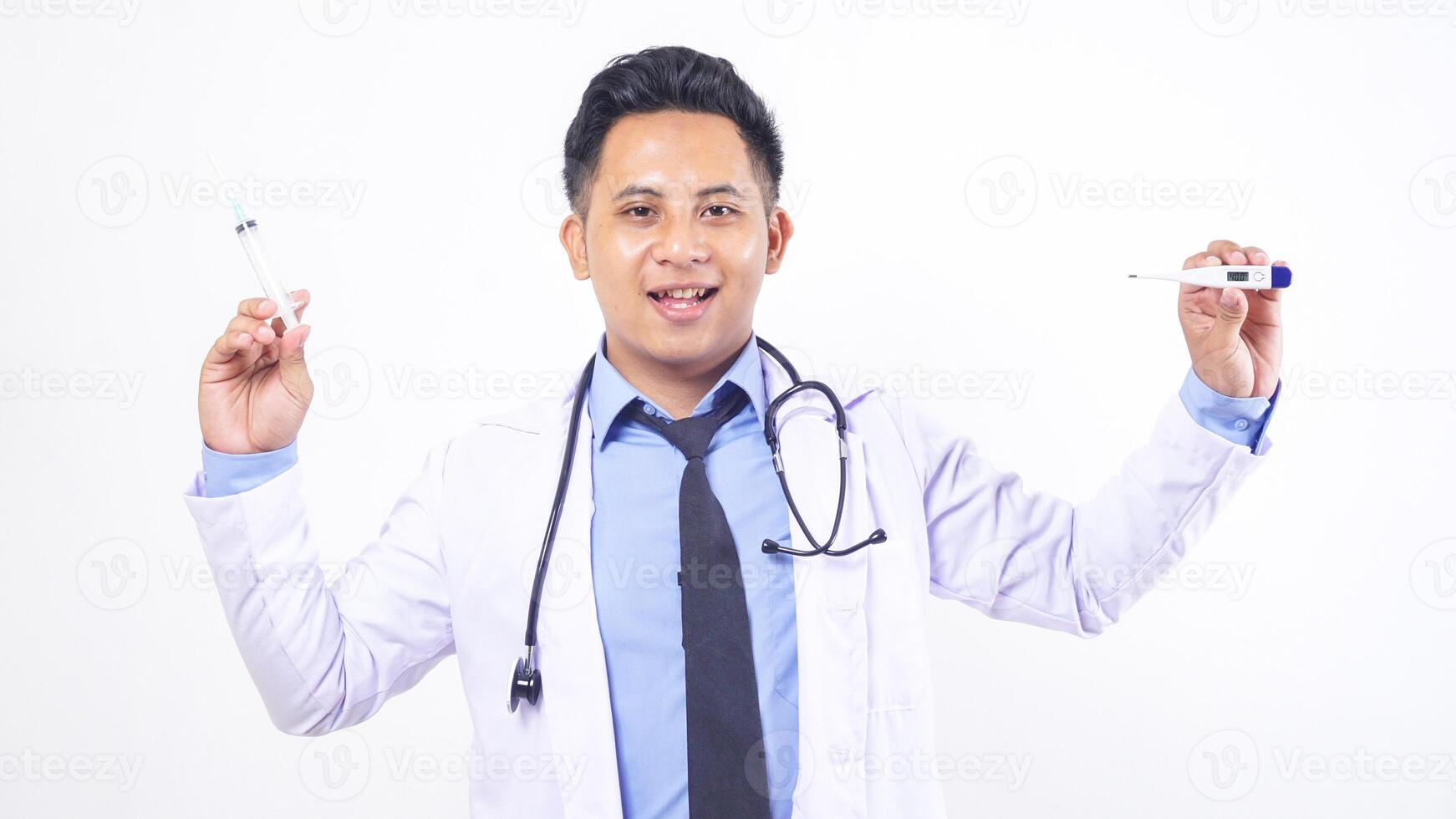Asian Male Doctor Holding Thermometer and Syringe on White Background photo