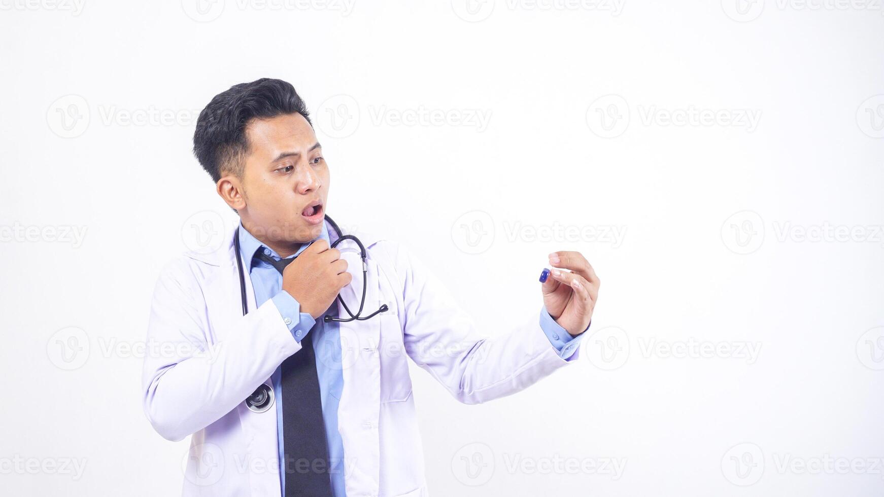 Shocked Asian Male Doctor Looking at Temperature in Thermometer on White Background photo
