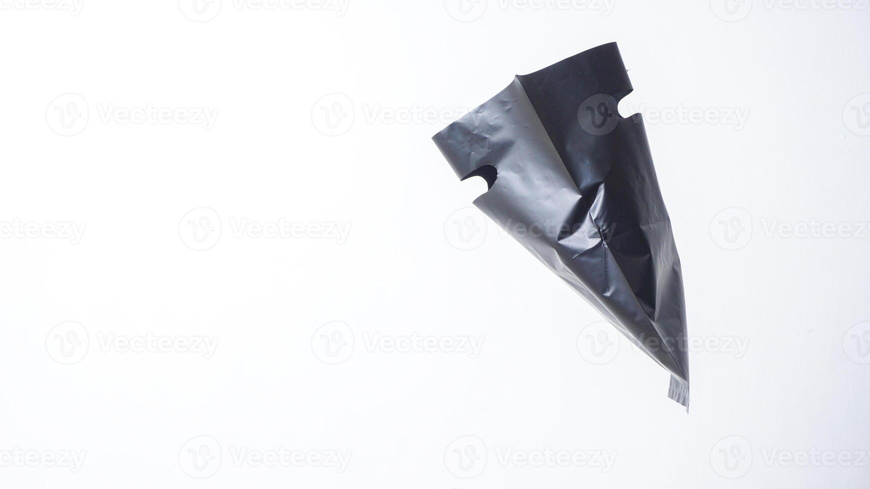 Side View of Open Black Plastic Bag with Handle on White Background photo