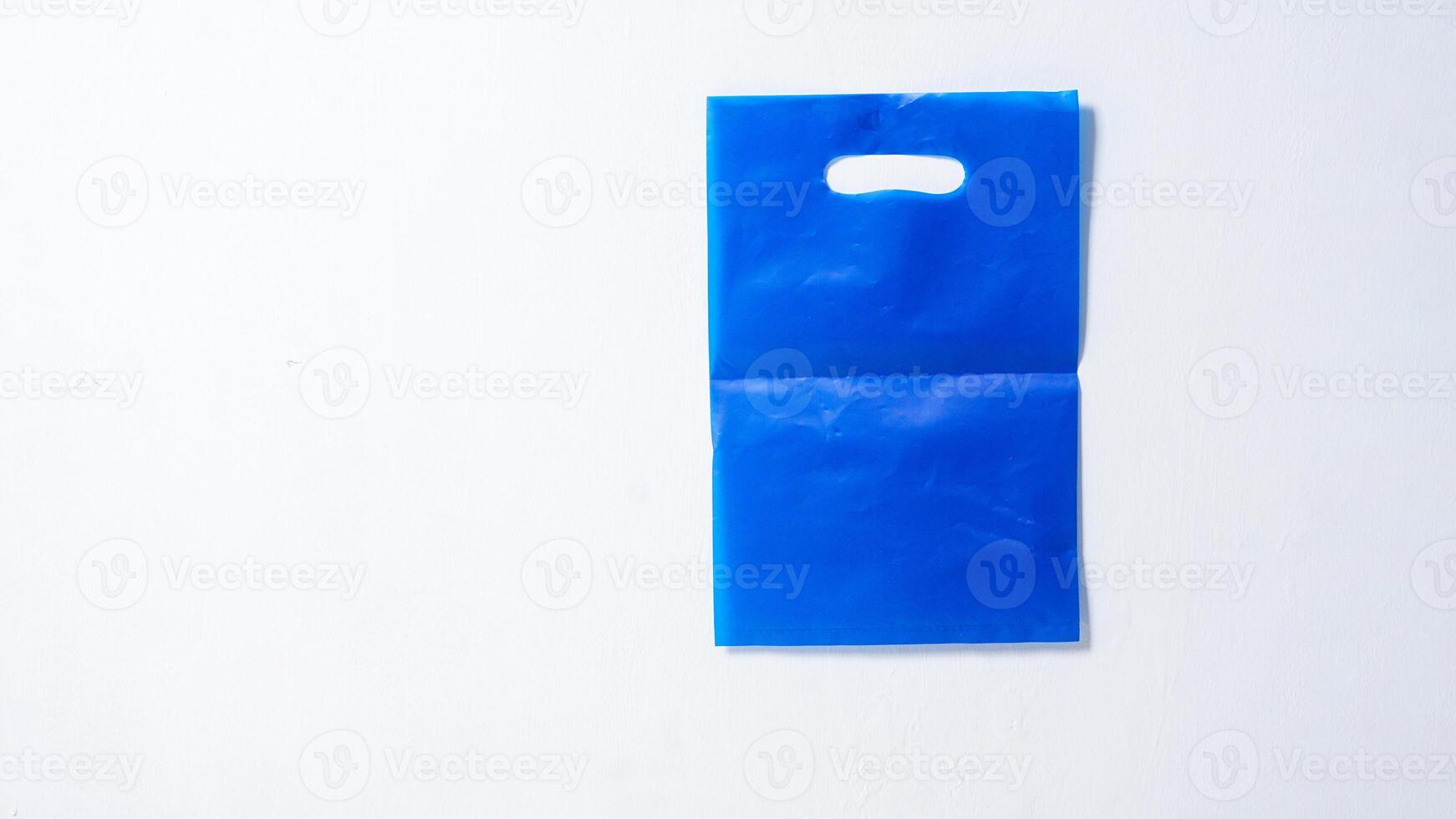 Blank Blue Plastic Bag Mock Up on White Background photo