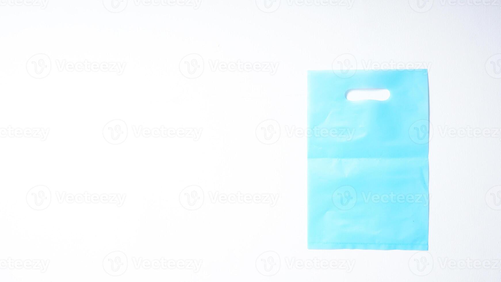 Blank Light Blue Plastic Bag Mock Up on White Background photo