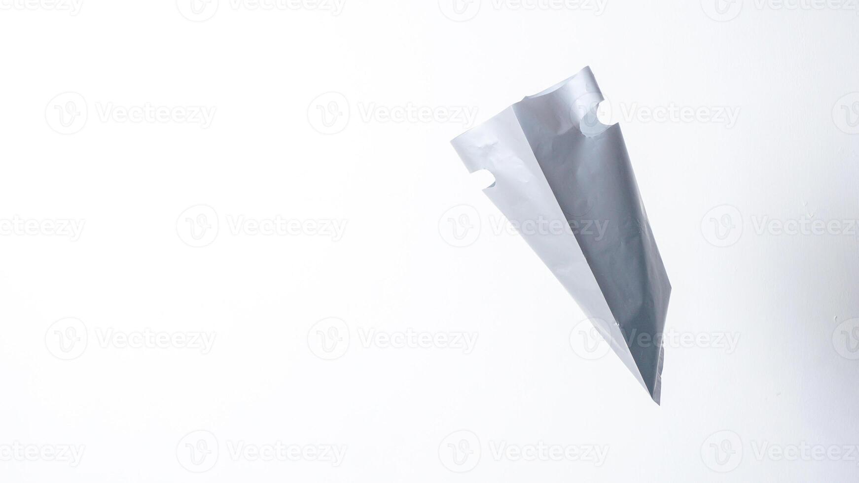 Side View of Open Blank Gray Plastic Bag on White Background photo