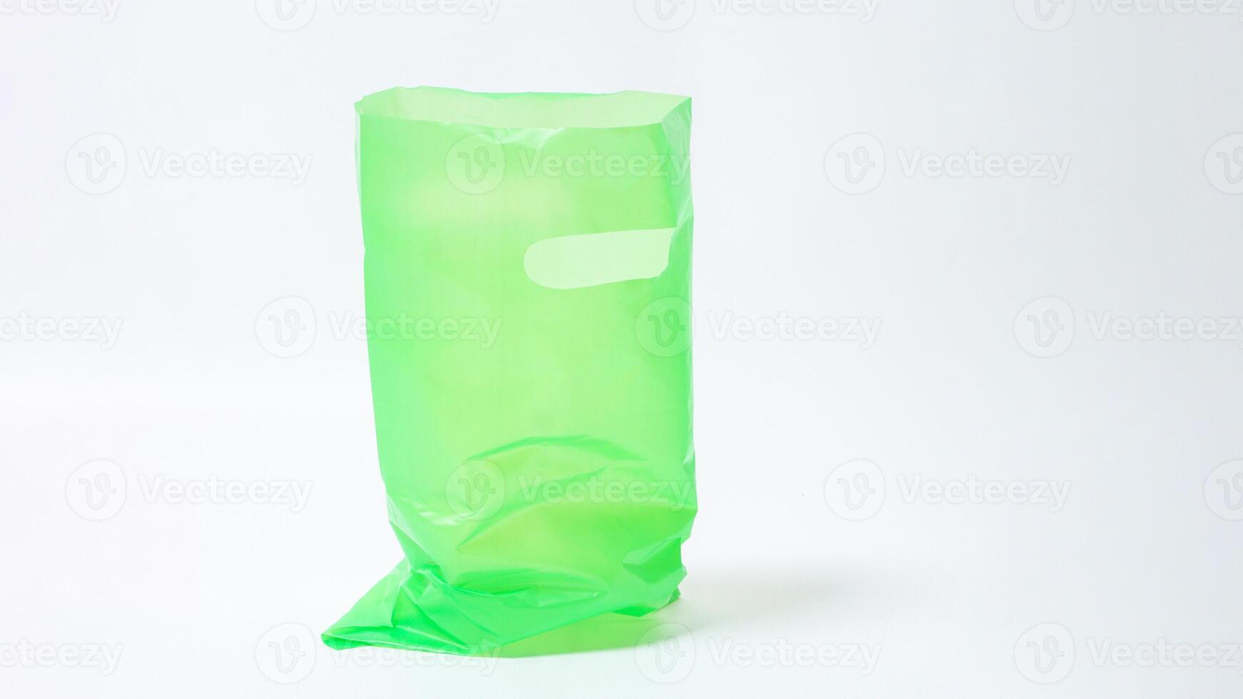 Open Green Plastic Bag with Handle on White Background photo