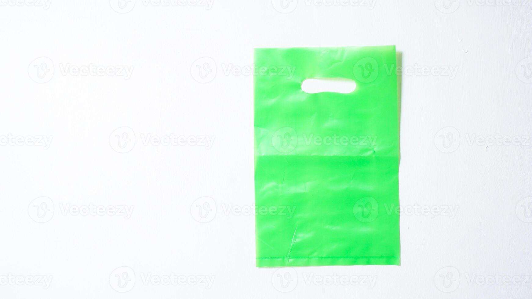 Blank Green Plastic Bag Mock Up on White Background photo