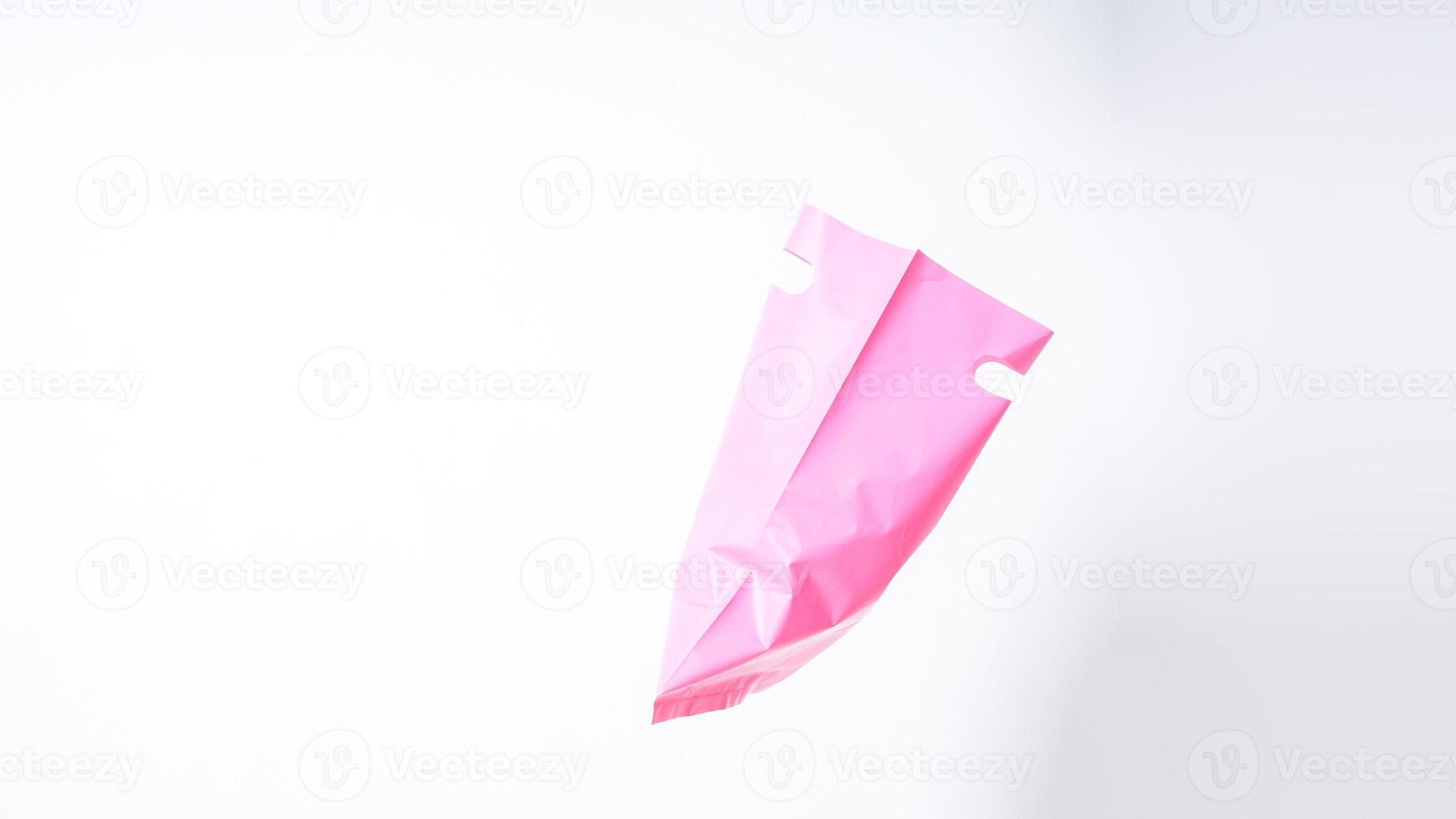 Side View of Open Pink Plastic Bag with Handle on White Background photo